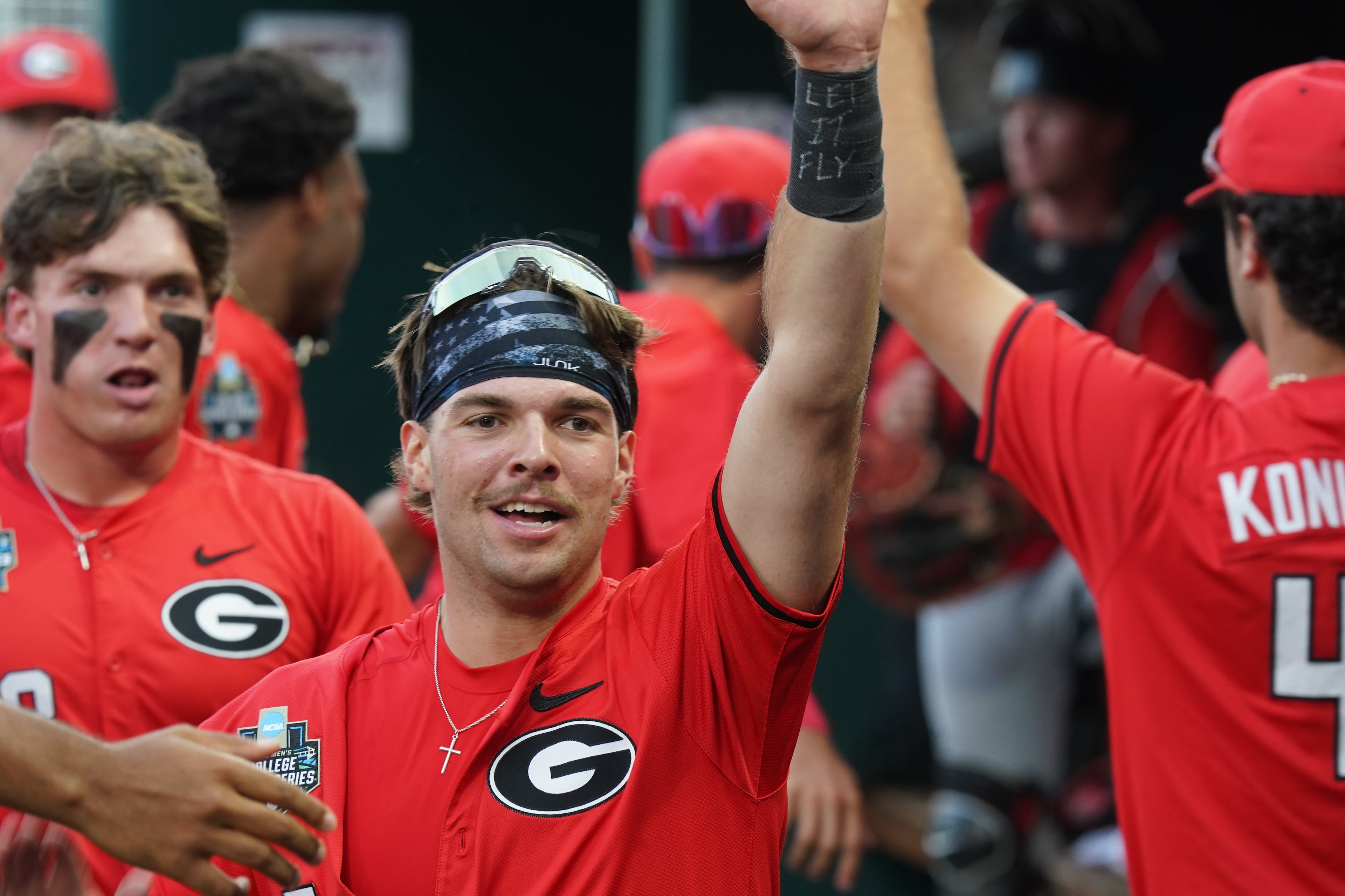 Georgia teammates react in the dugout after a run is scored in the fifth inning during an NCAA baseball College World Series elimination game against Texas, Tuesday, June 16, 2026 in Omaha, Neb. Georgia won 2-0. (AP Photo/Vera Nieuwenhuis)