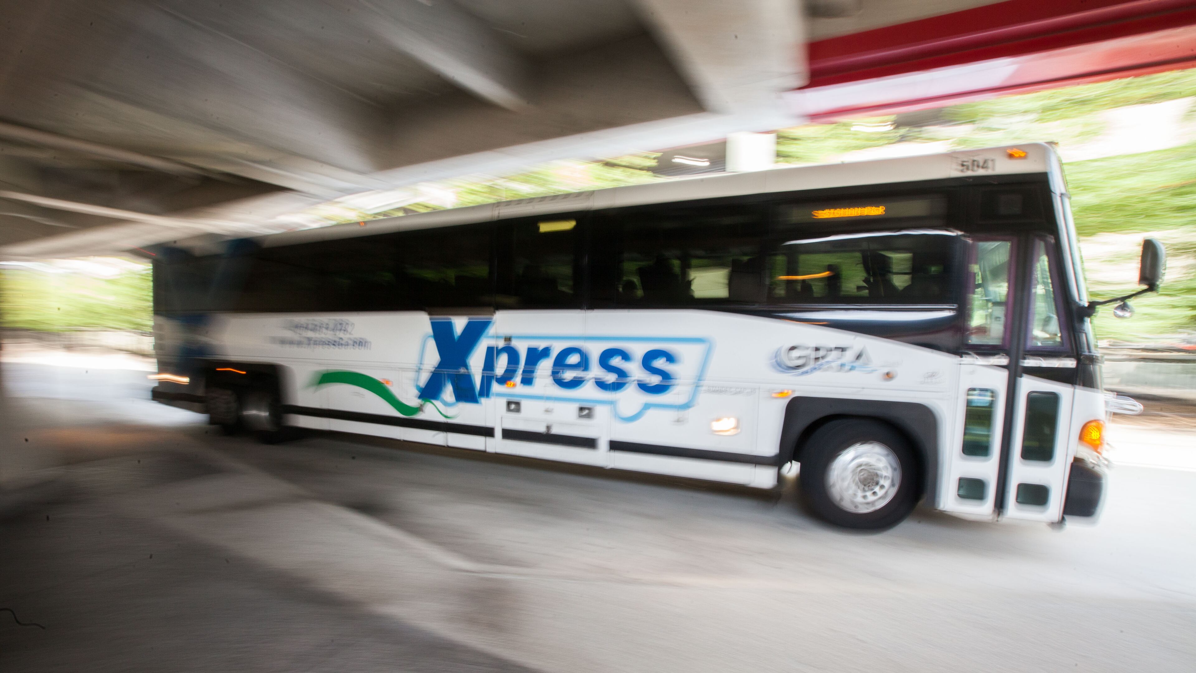A GRTA Xpress bus leaves after picking up passengers at the Dunwoody Marta Station. (Branden Camp / Special)