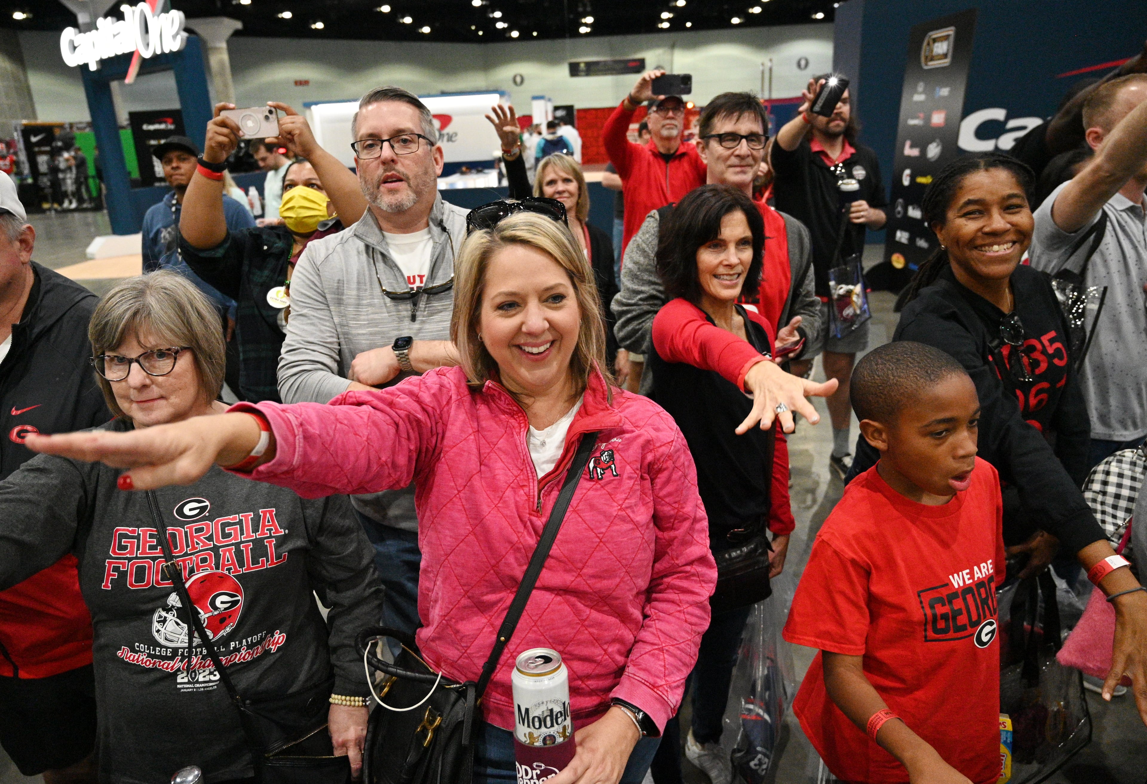 Georgia fans cheer as Georgia Redcoat Marching Band, cheerleaders, baton twirlers and Hairy Dog perform during a pep rally at the Playoff Fan Central at the LA Convention Center, Sunday, Jan. 8, 2023, in Los Angeles. (Hyosub Shin / Hyosub.Shin@ajc.com)