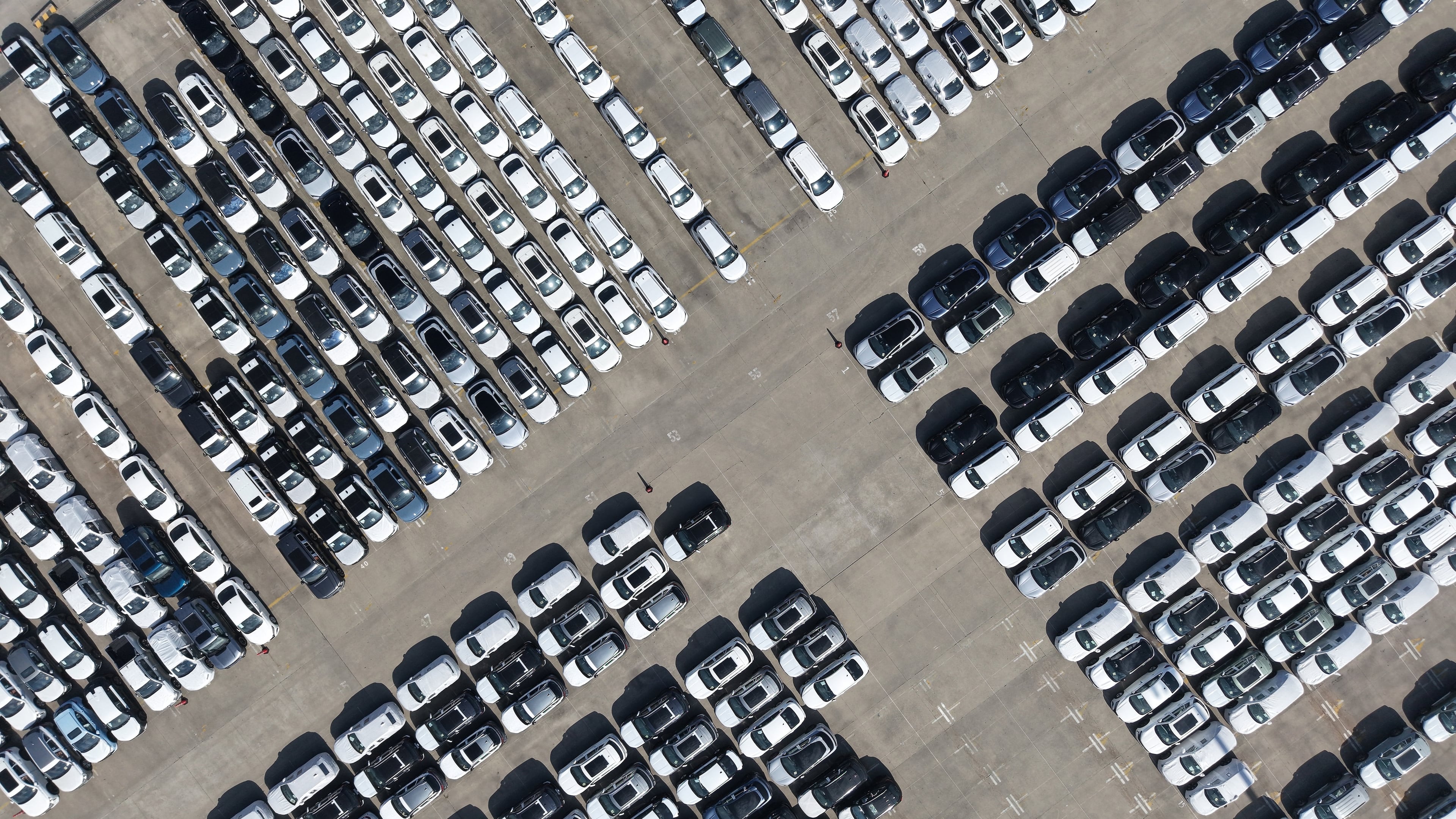 FILE - An aerial view of new cars awaiting export to oversea markets is seen at a port in Shanghai, March 10, 2026. (Chinatopix via AP, File)