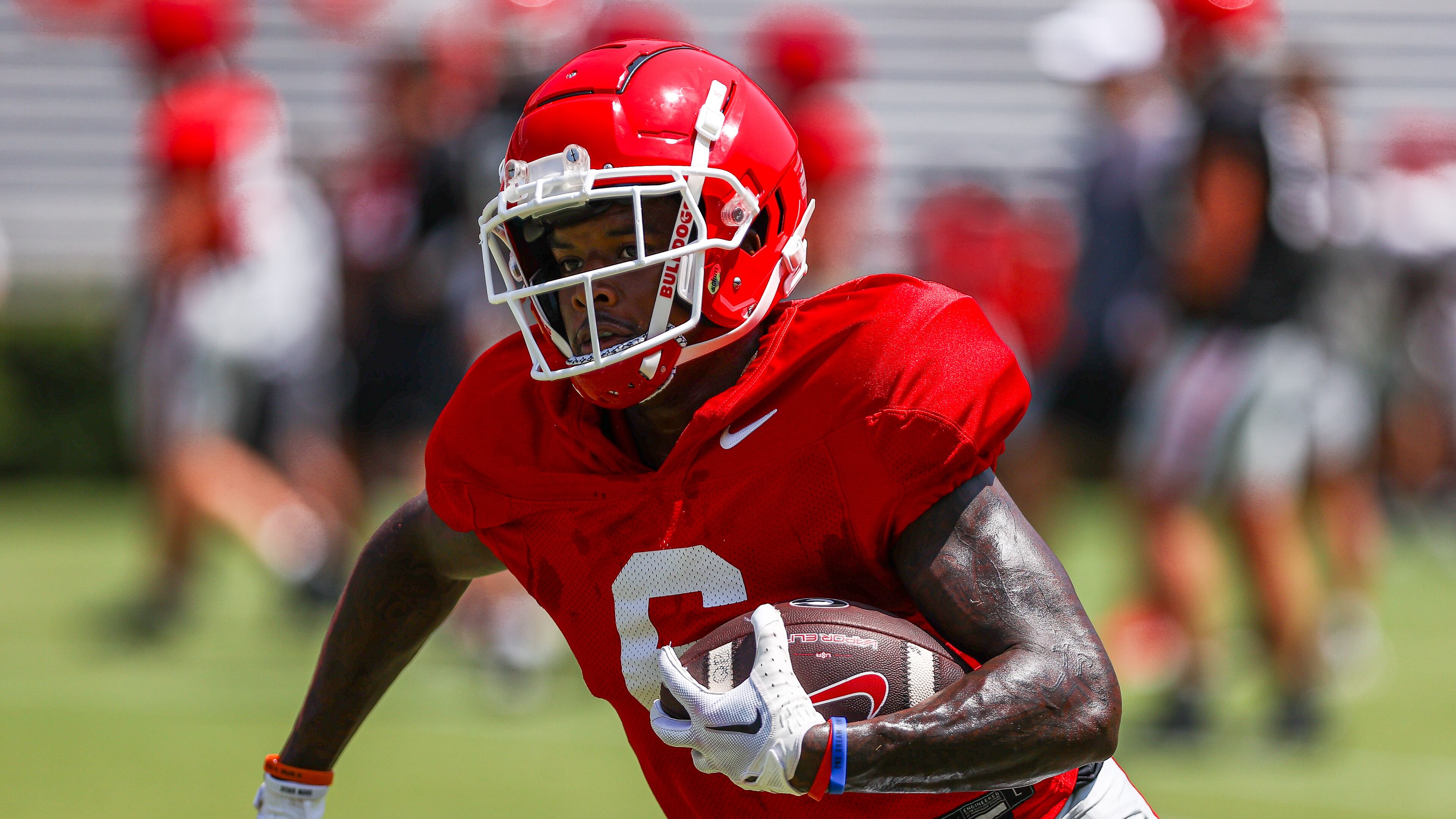 Georgia wide receiver Dominic Lovett (6) runs with the ball after hauling in a pass from quarterback Carson Beck this past Saturday at Sanford Stadium. The junior transfer who played for Missouri last season has proved to be a great acquisition for the Bulldogs and appears poised to play a lot -- if not start -- this fall. (Photo by Tony Walsh/UGA Athletics)
