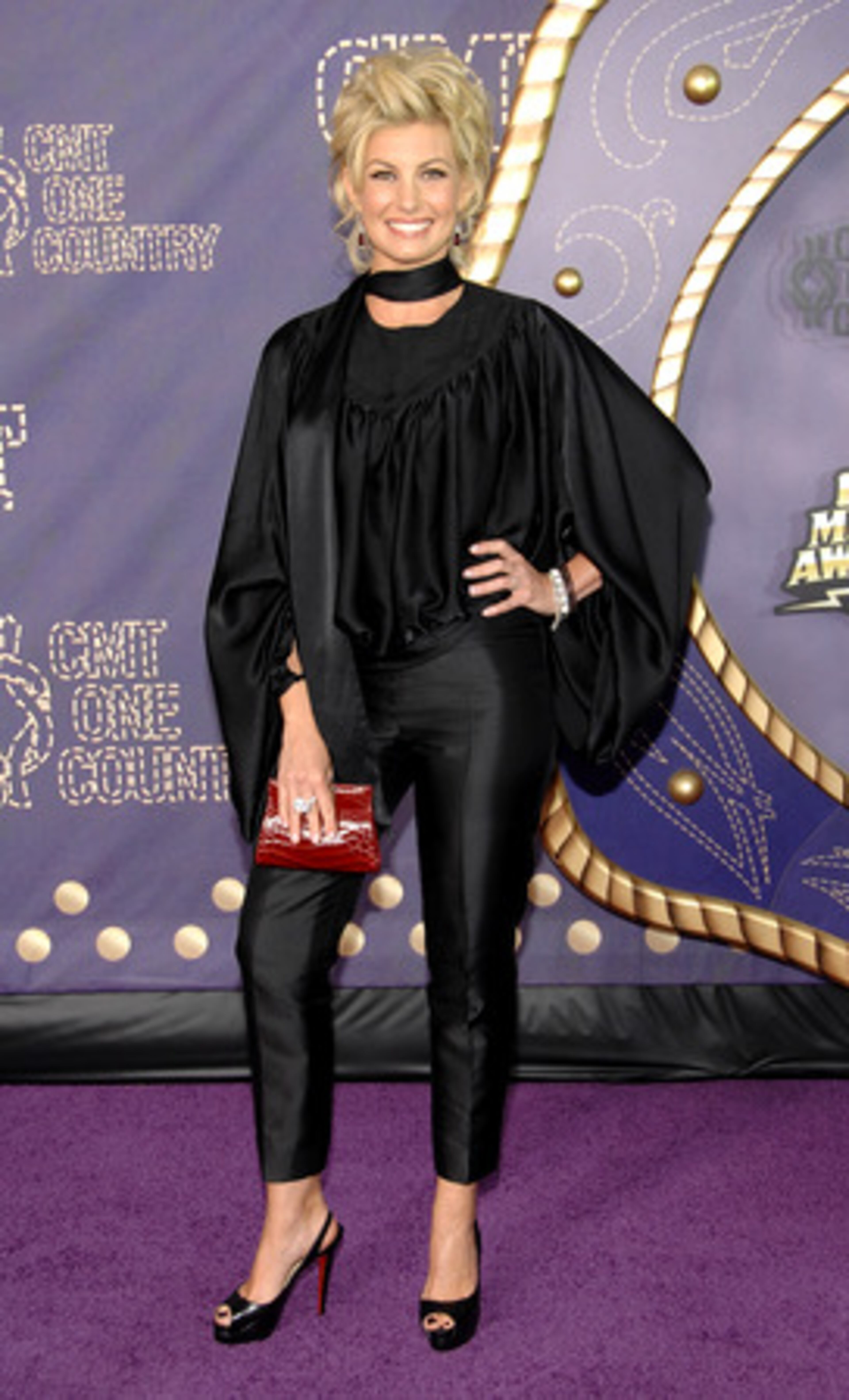 If you asked Faith Hill what her favorite movie is, we bet she would say "Grease" since she's channeling Olivia Newton-John's fashion. You better shape up, Faith!