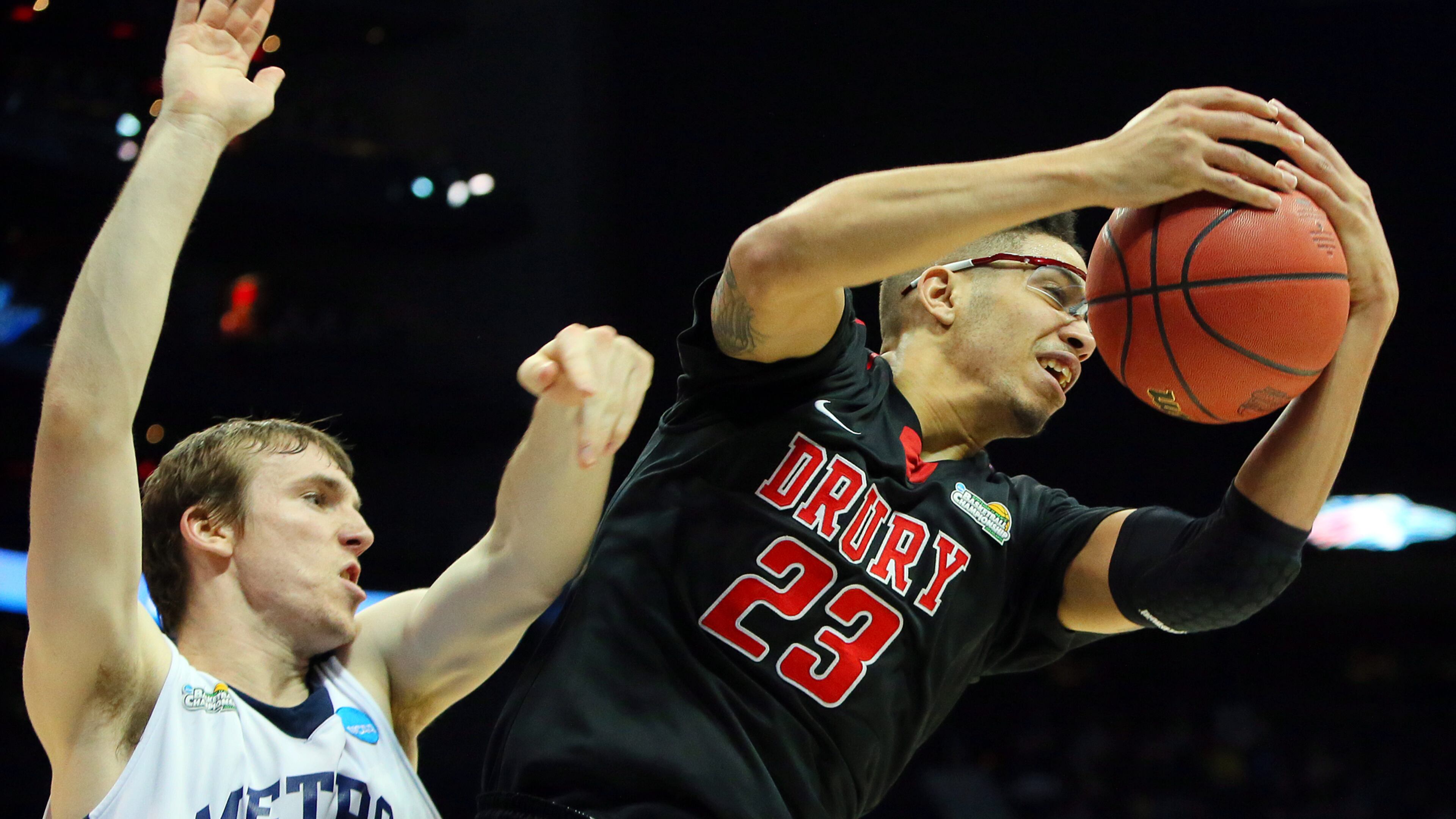 Drury forward Ian Carter pulls down a rebound as Metro State guard Mitch McCarron defends during the second half in the NCAA Division II National Championship on Sunday, April 7, 2013, in Atlanta.