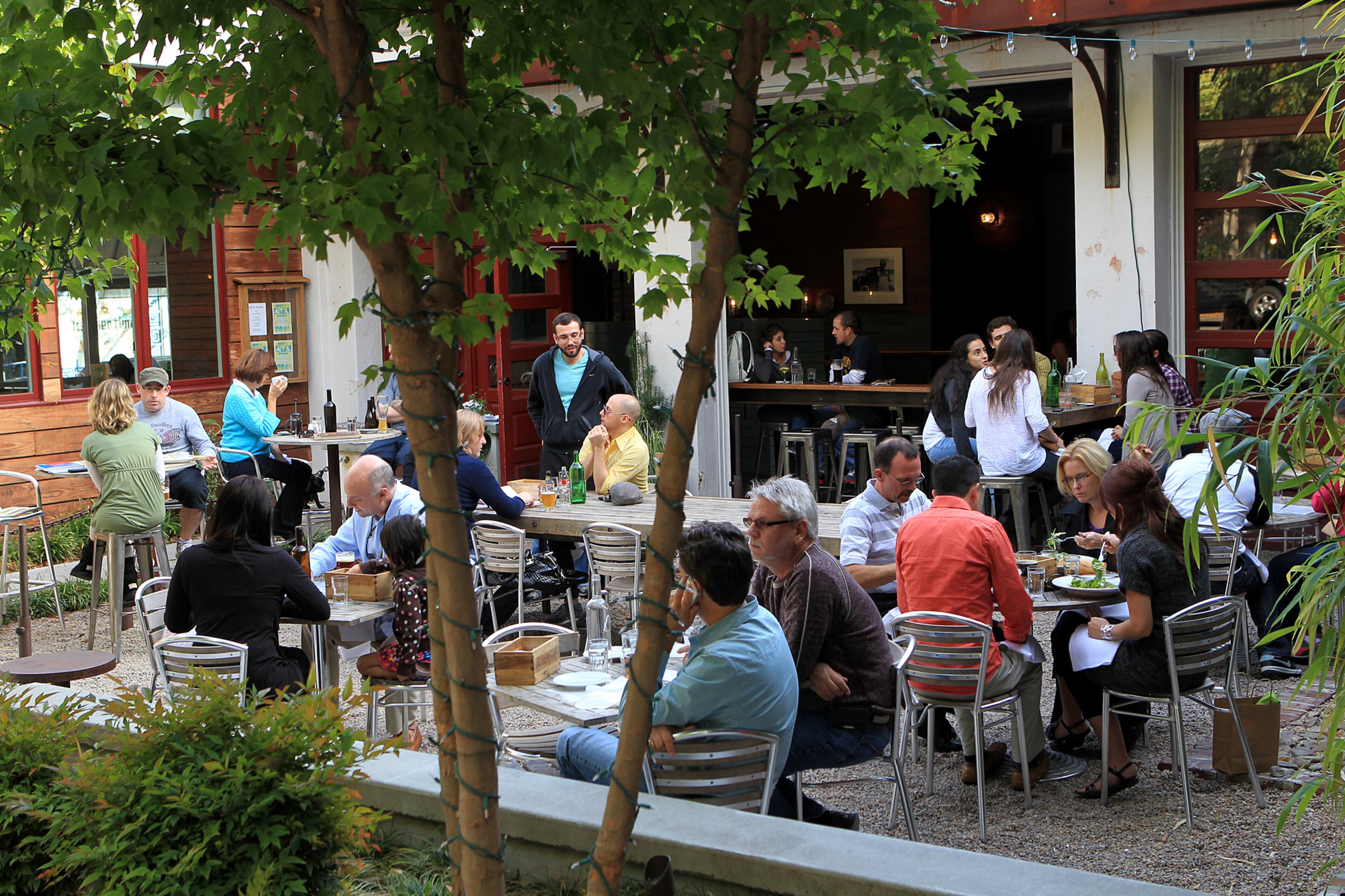 Patio dining: Spring is a great time to eat outside, like these patrons of Leon's Full Service in Decatur.