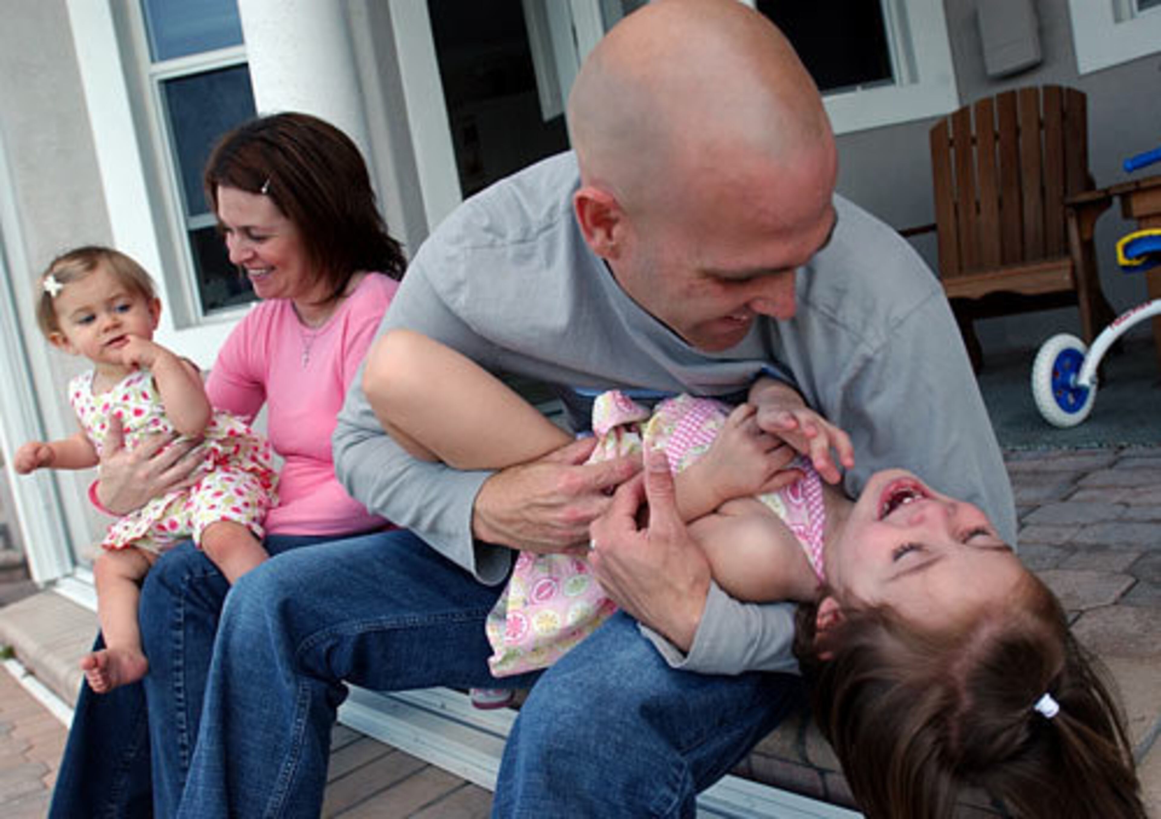 And they quickly learned that Team Hudson - wife Kim and daughters Tess (left) and Kennedie (right) - is one tight-knit unit off the field. Son Kade Timothy joined the family soon after this photo was taken in 2005.