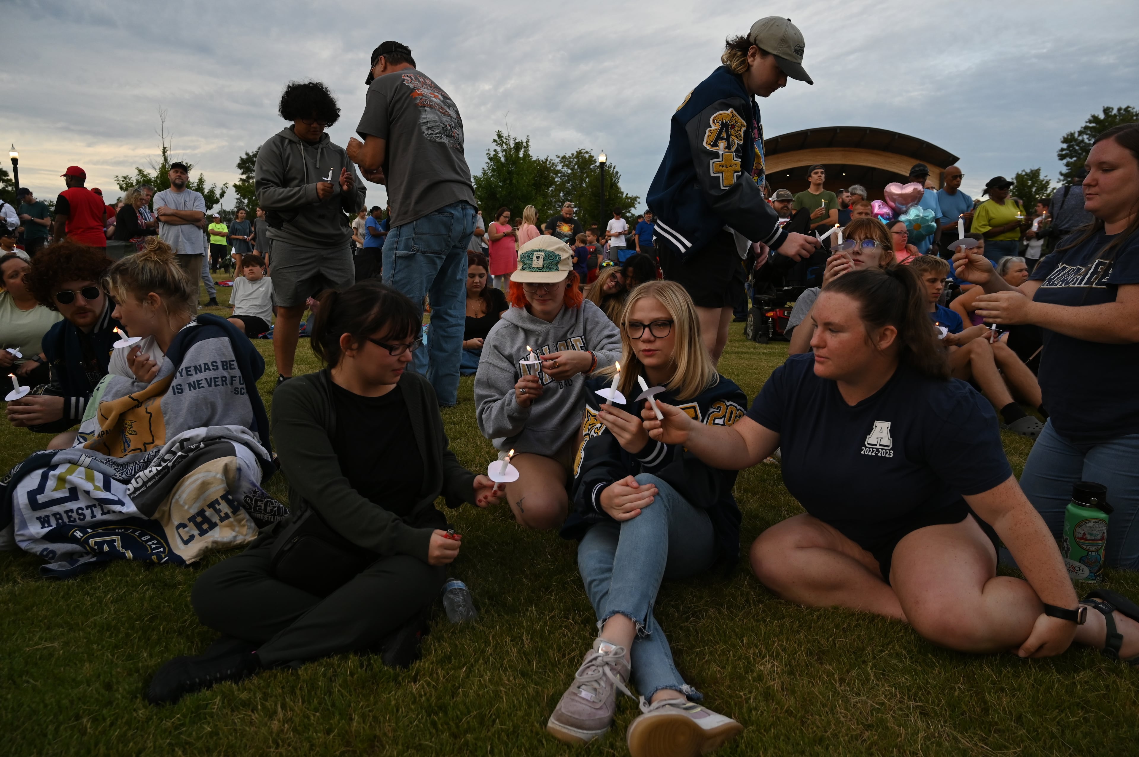 Community members and leaders come together during a 2024 candlelight vigil at Jug Tavern Park in Winder after a deadly shooting at Apalachee High School. (Hyosub Shin/AJC)
