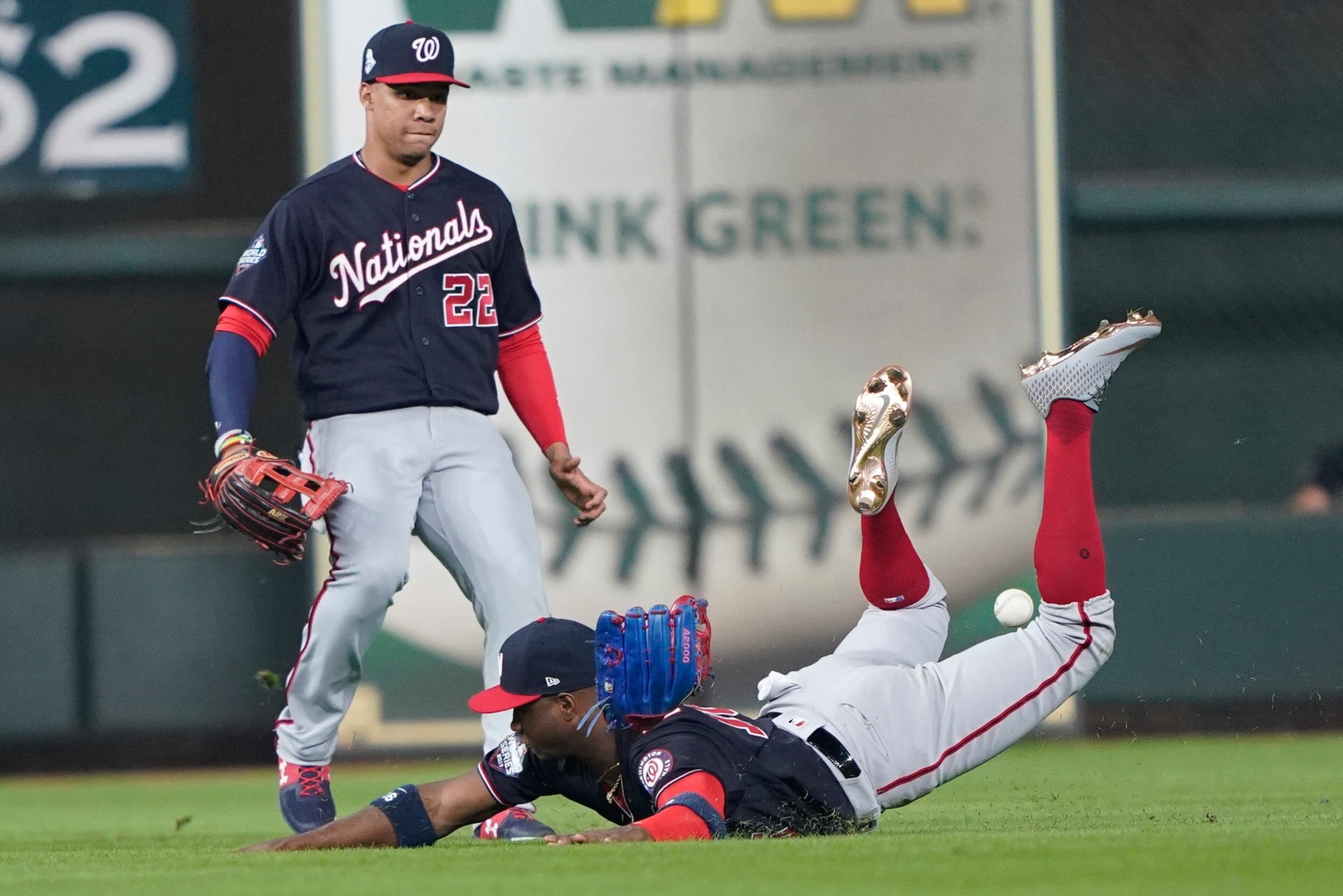 Washington Nationals' Victor Robles can't catch a ball hit by Houston Astros' Yuli Gurriel during the third inning of Game 1 of the baseball World Series Tuesday, Oct. 22, 2019, in Houston. (AP Photo/David J. Phillip)