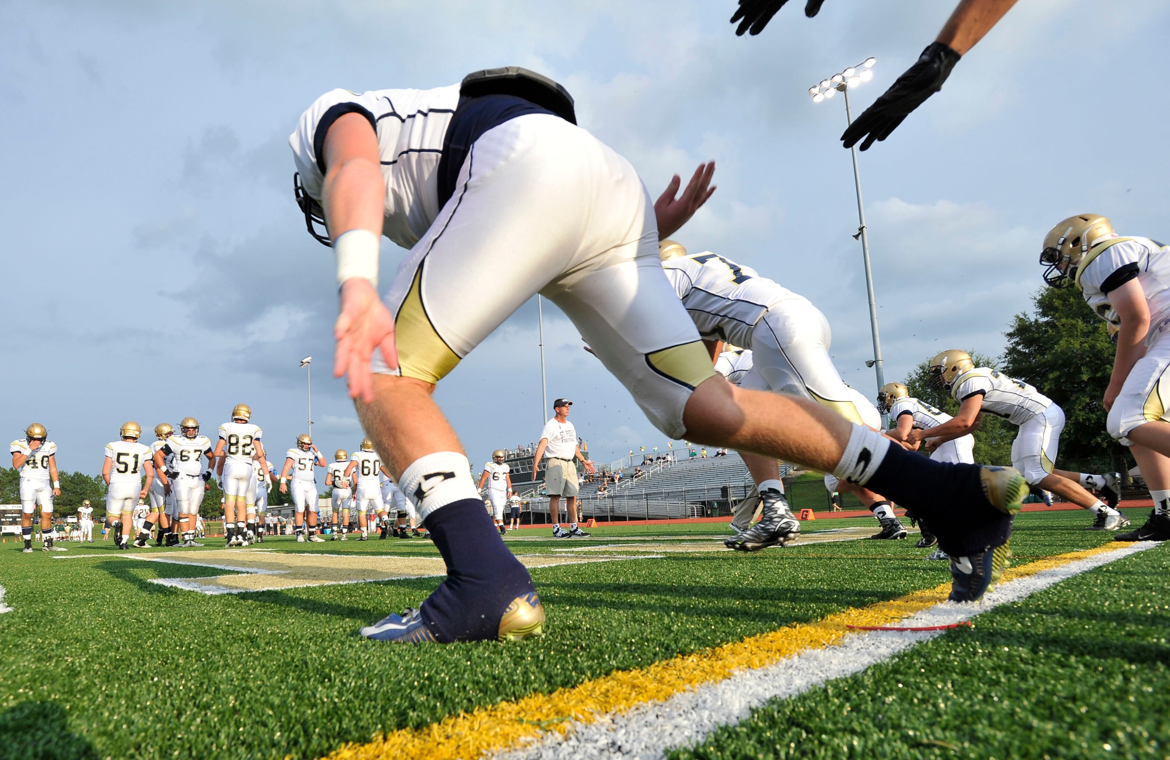 St. Pius players warm up to take on Blessed Trinity before a high school football game, Friday, Aug. 28, 2015, in Roswell (Special/John Amis)