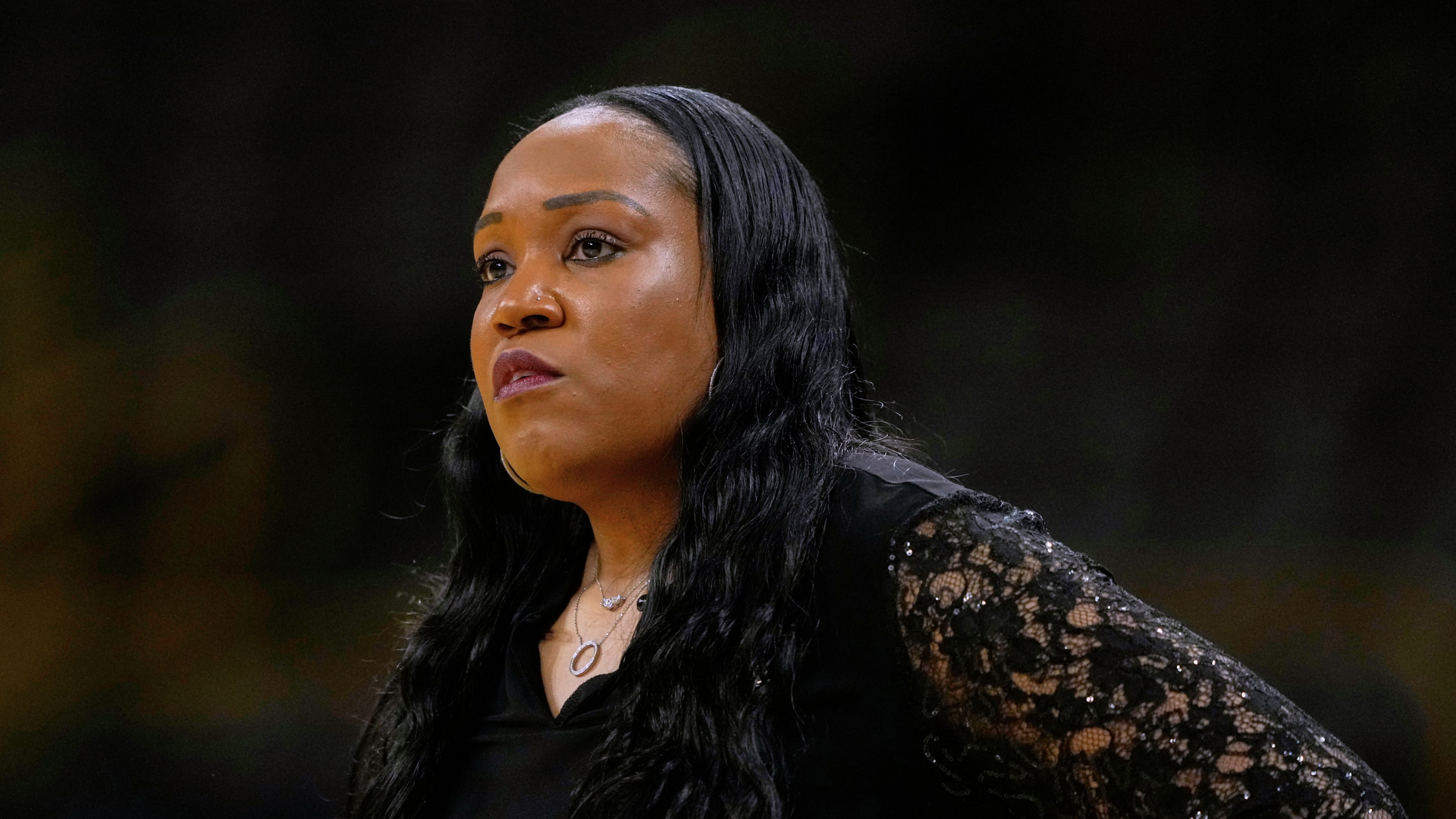 FILE - Virginia head coach Amaka Agugua-Hamilton watches from the bench during the first half in a First Four college basketball game against Arizona State in the NCAA Tournament, March 19, 2026, in Iowa City, Iowa. (AP Photo/Charlie Neibergall, File)