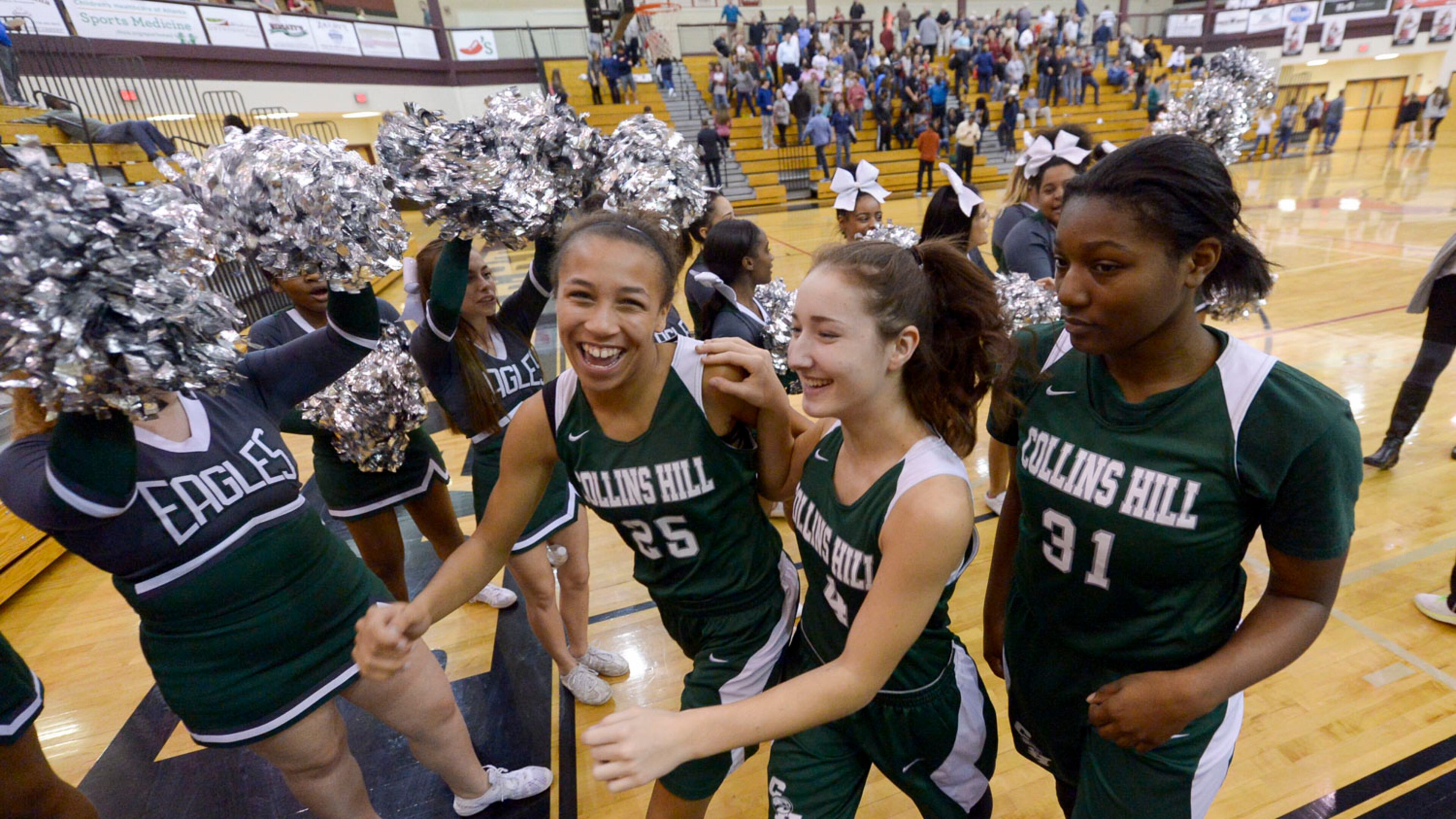 Collins Hill freshman Savannah Samuels (25), sophomore Claire Starjevich (4), and junior Jada Rice (31) celebrate their win over Lambert in a quarterfinal basketball game at Lambert High School on Tuesday. SPECIAL/Daniel Varnado