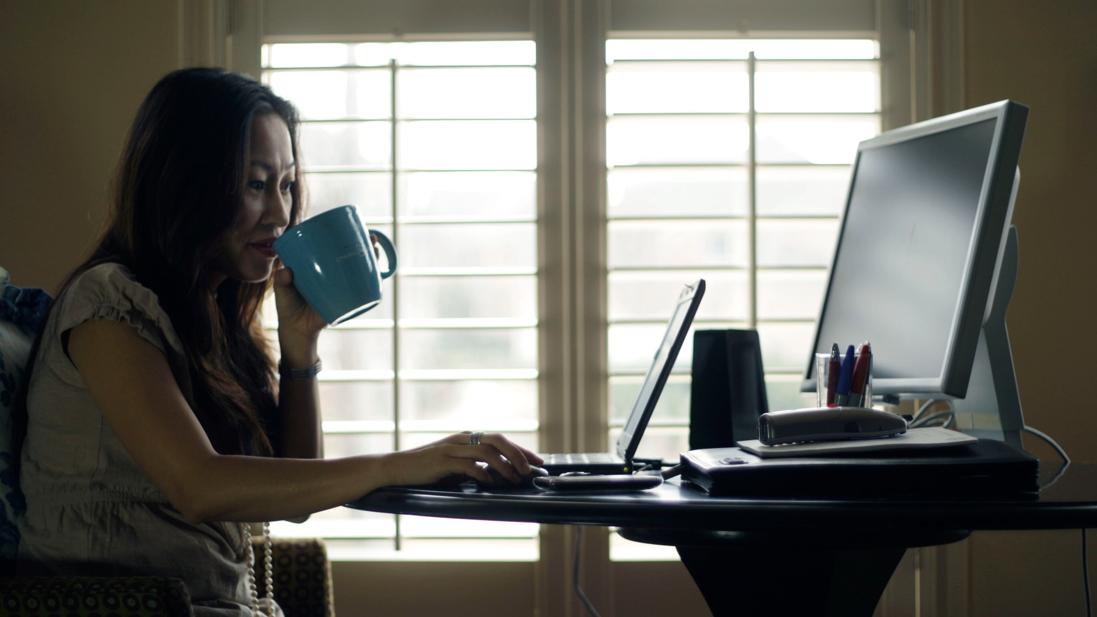 Denise Kenson-Liu works from her Snellville home one day a week for her job with the IT department of Gwinnett County on Fri, Feb.18, 2011. Bob Andres bandres@ajc.com