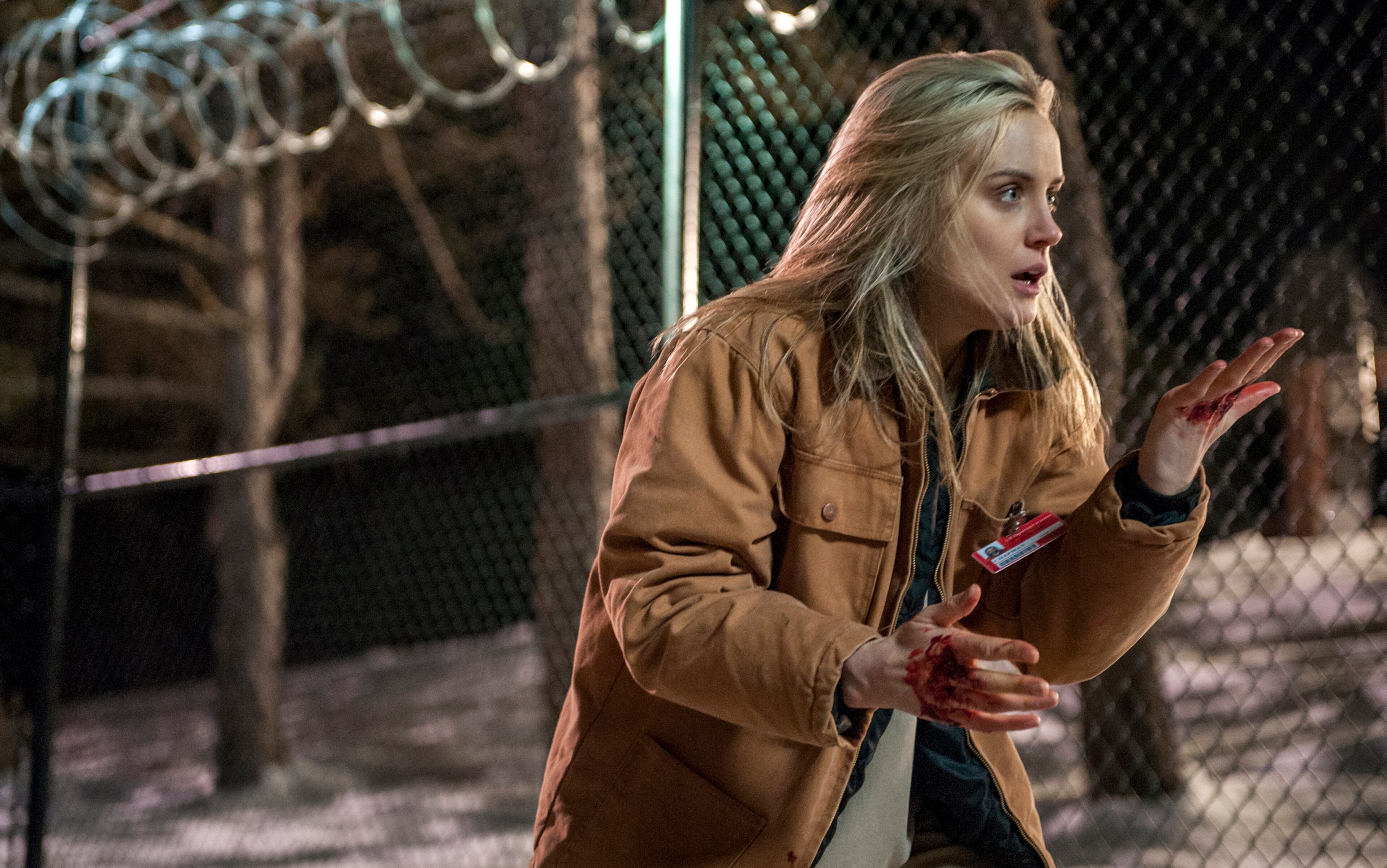 This image released by Netflix shows Taylor Schilling in a scene from "Orange is the New Black." The second season of the prison series will be available on Friday, June 6, on Netflix. (AP Photo/Netflix, JoJo Whilden)