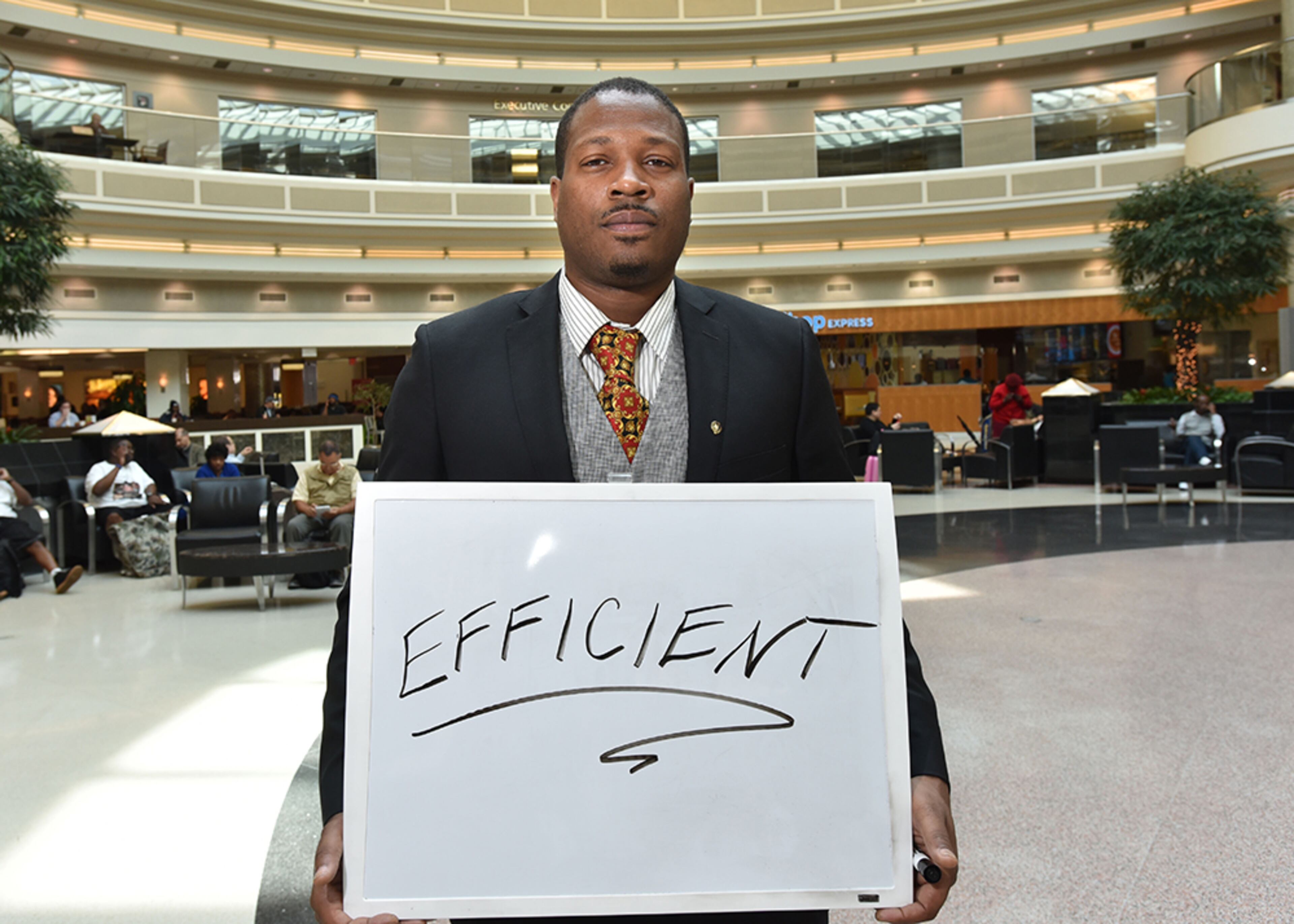 Jesse Arnold, of Augusta, finds the airport "Efficient." (HYOSUB SHIN / hshin@ajc.com)