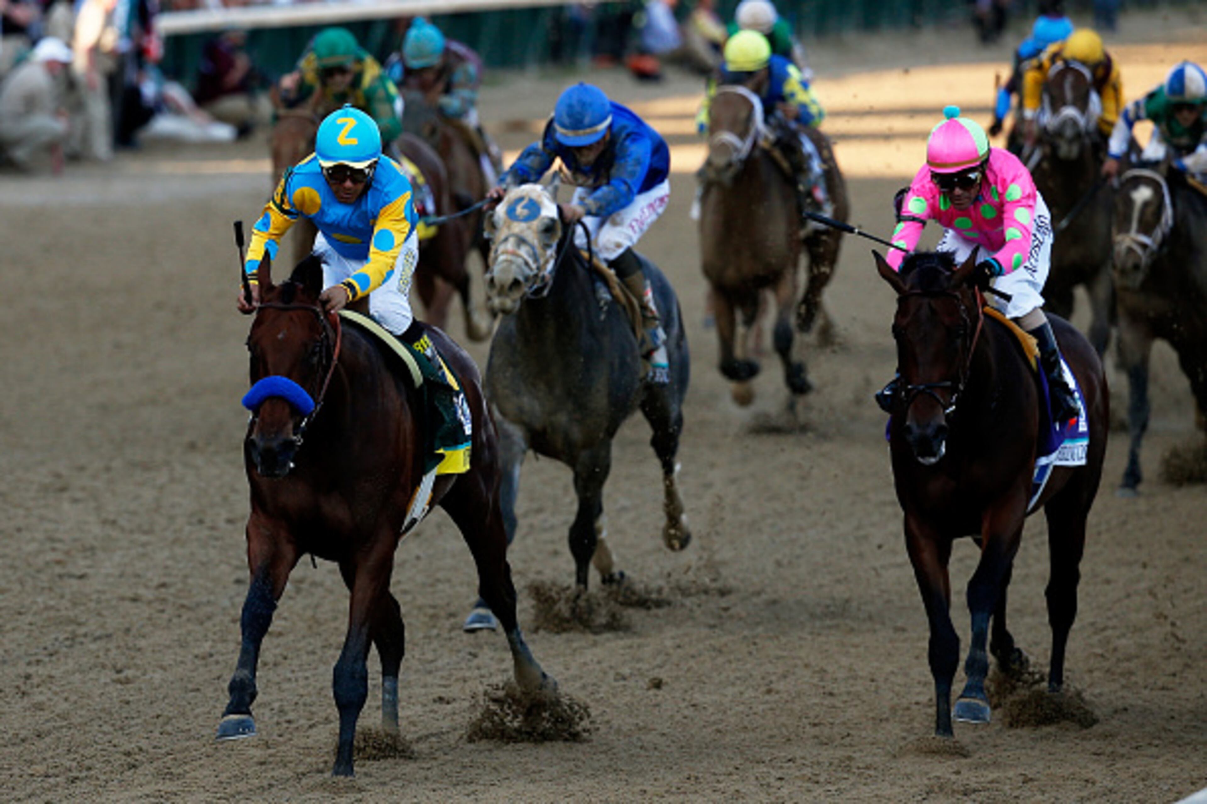 LOUISVILLE, KY - MAY 02: American Pharoah #18, ridden by Victor Espinoza, leads the field during the 141st running of the Kentucky Derby at Churchill Downs on May 2, 2015 in Louisville, Kentucky. (Photo by Rob Carr/Getty Images)