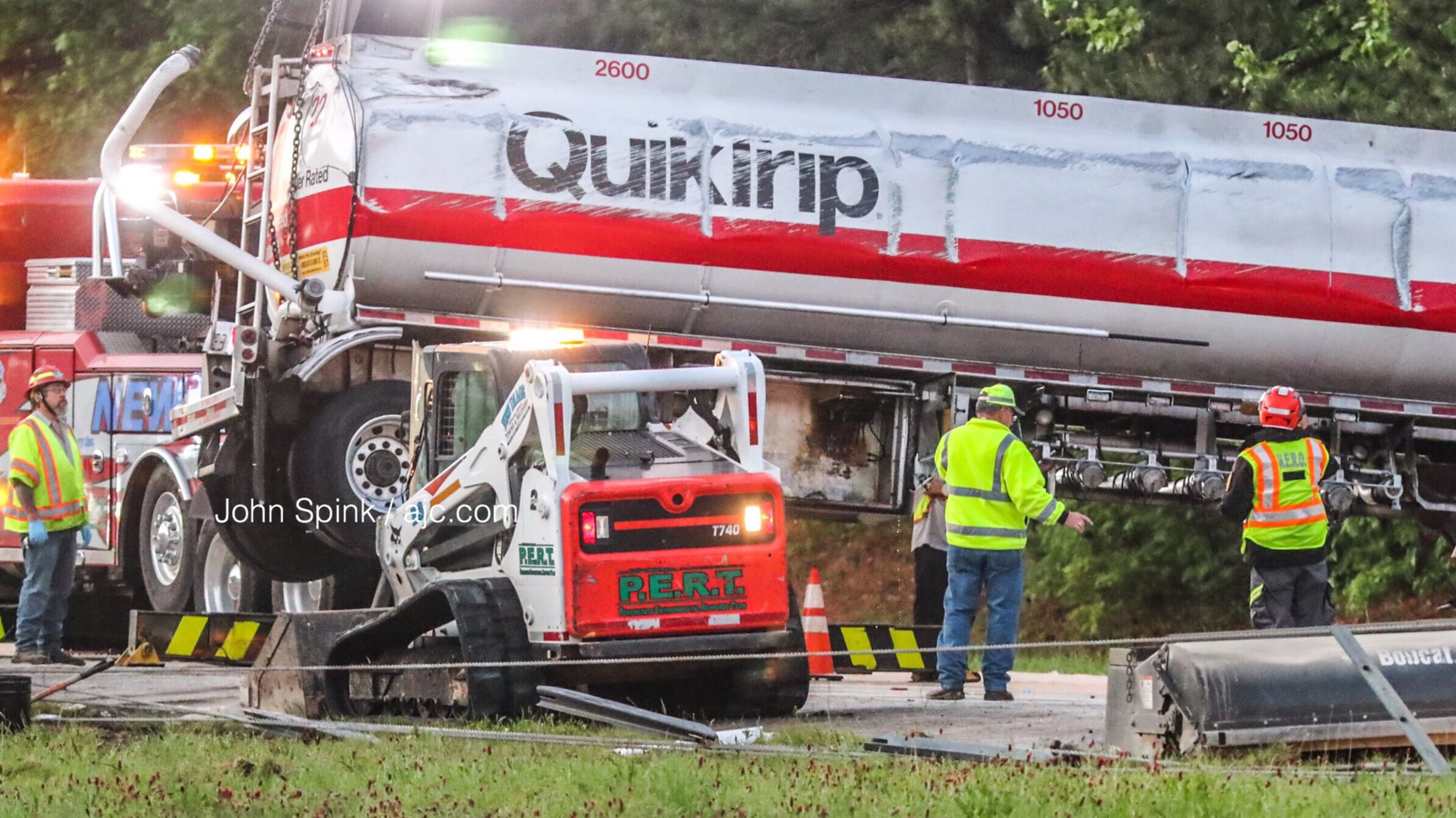 Crews worked early Tuesday morning to clear away a wrecked gas tanker truck that overturned on I-675.