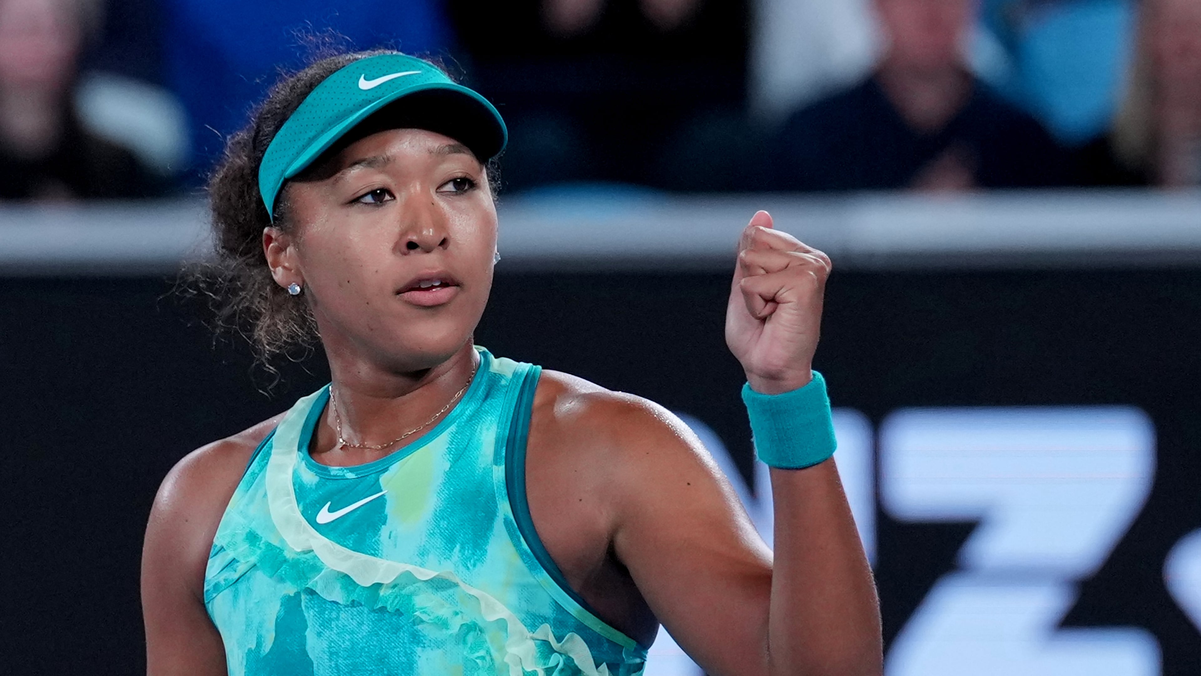 Naomi Osaka of Japan reacts after defeating Sorana Cirstea of Romania in their second round match at the Australian Open tennis championship in Melbourne, Australia, Thursday, Jan. 22, 2026. (AP Photo/Dita Alangkara)