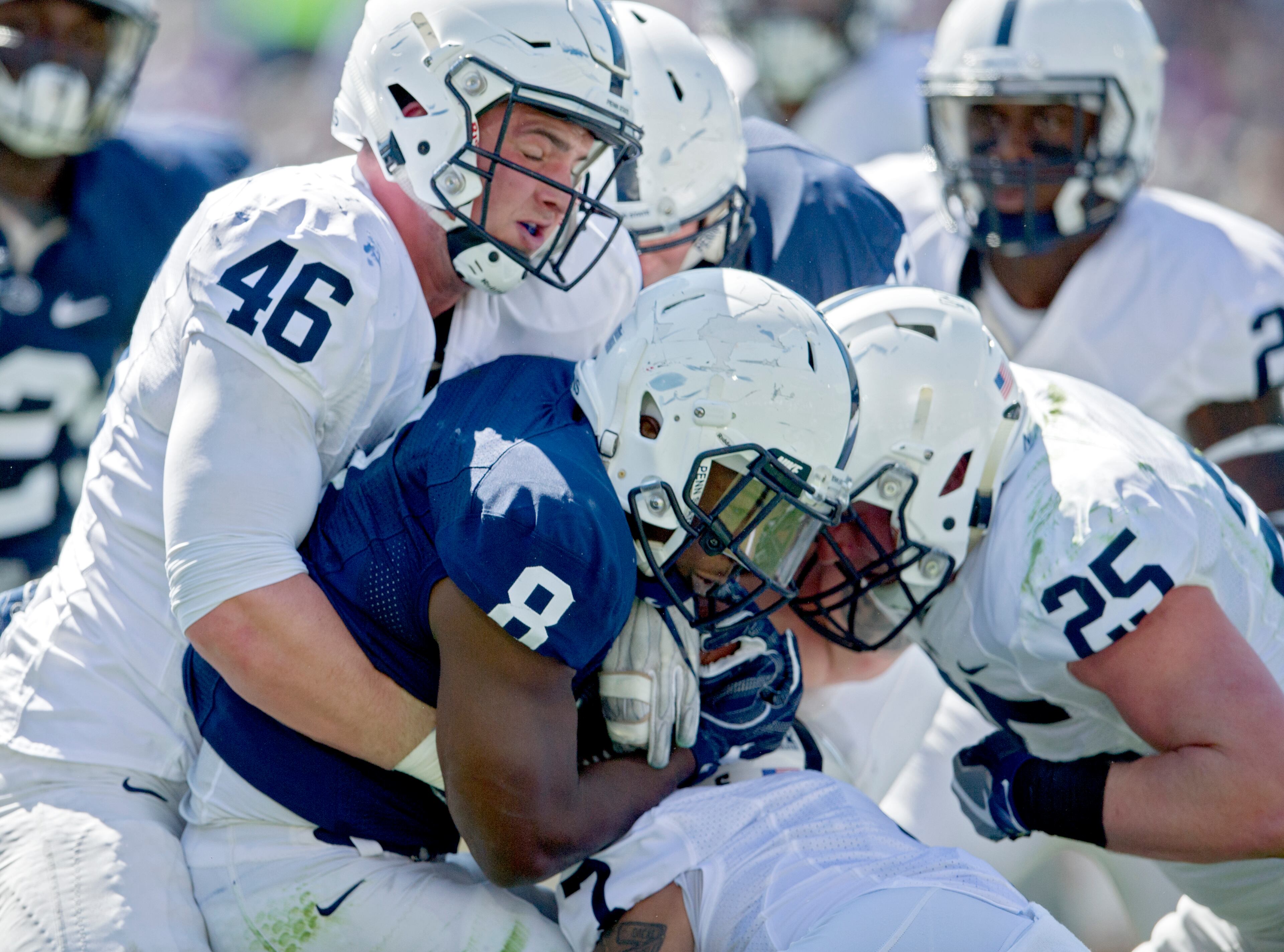 Penn State running back Mark Allen is stopped during the Blue-White spring NCAA college football game, Saturday, April 16, 2016, in State College, Pa. (Abby Drey/Centre Daily Times via AP)