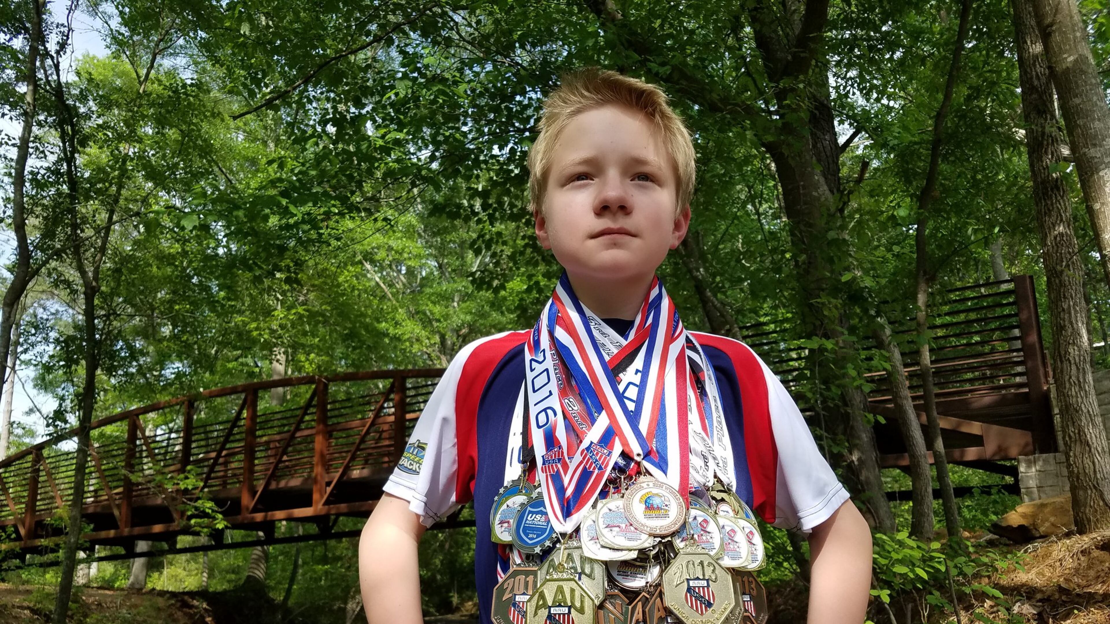 P.J. Ball, 13, shows off the nearly 80 medals he has won in sport stacking competitions around the world. The Villa Rica teen discovered the sport at age 7 while watching YouTube videos. CONTRIBUTED