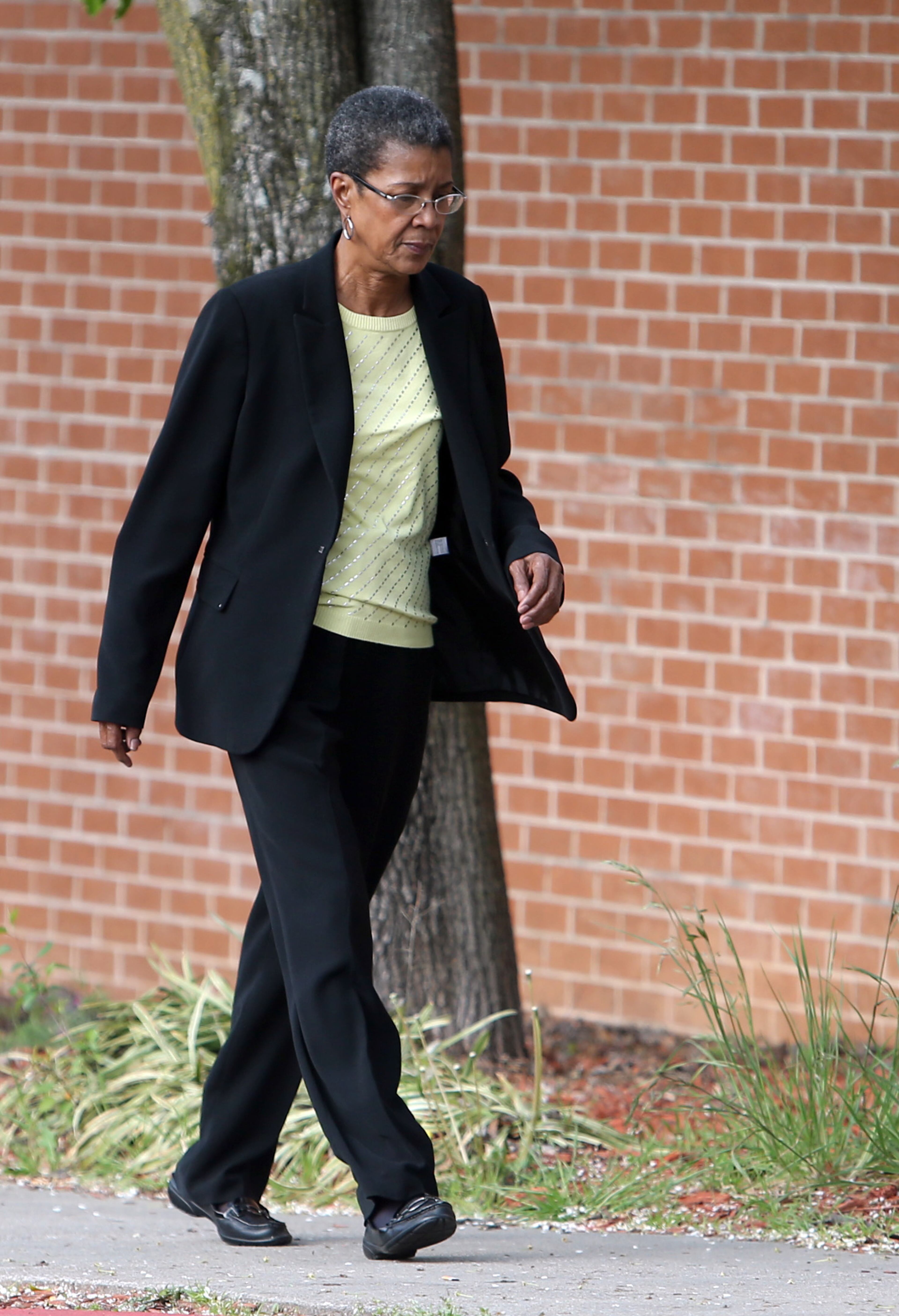 Dessa Curb, former teacher at Dobbs Elementary School. heads into the Fulton County Jail on Tuesday, April 2, 2013 to turn herself in.