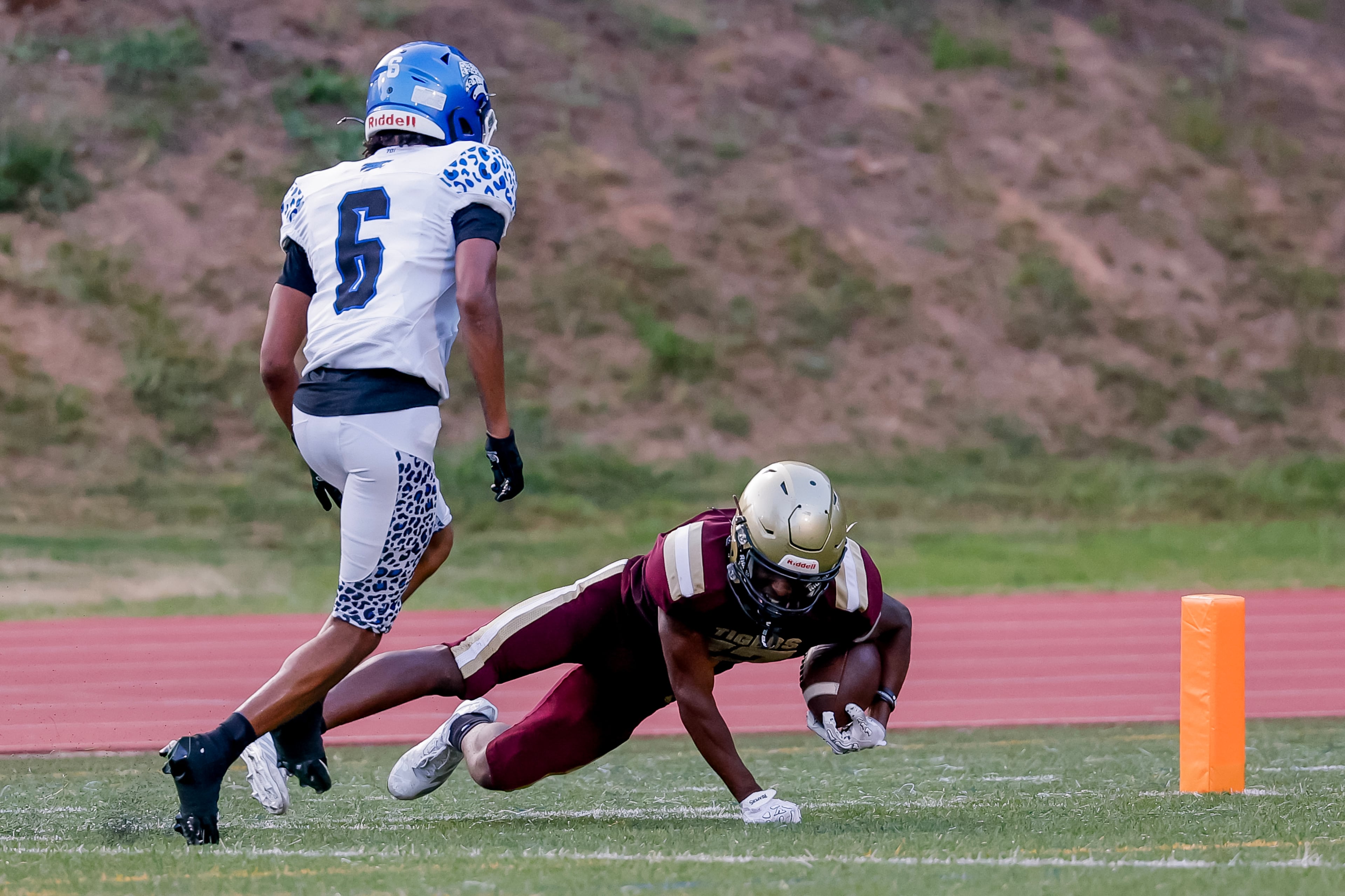 Tucker’s Jerron Guiden (right) makes a long third-down reception against Stephenson defender Josiah Ashmon at Hallford Stadium on Friday, Sept. 4, 2026, in Clarkston. (Erik S. Lesser for the AJC)