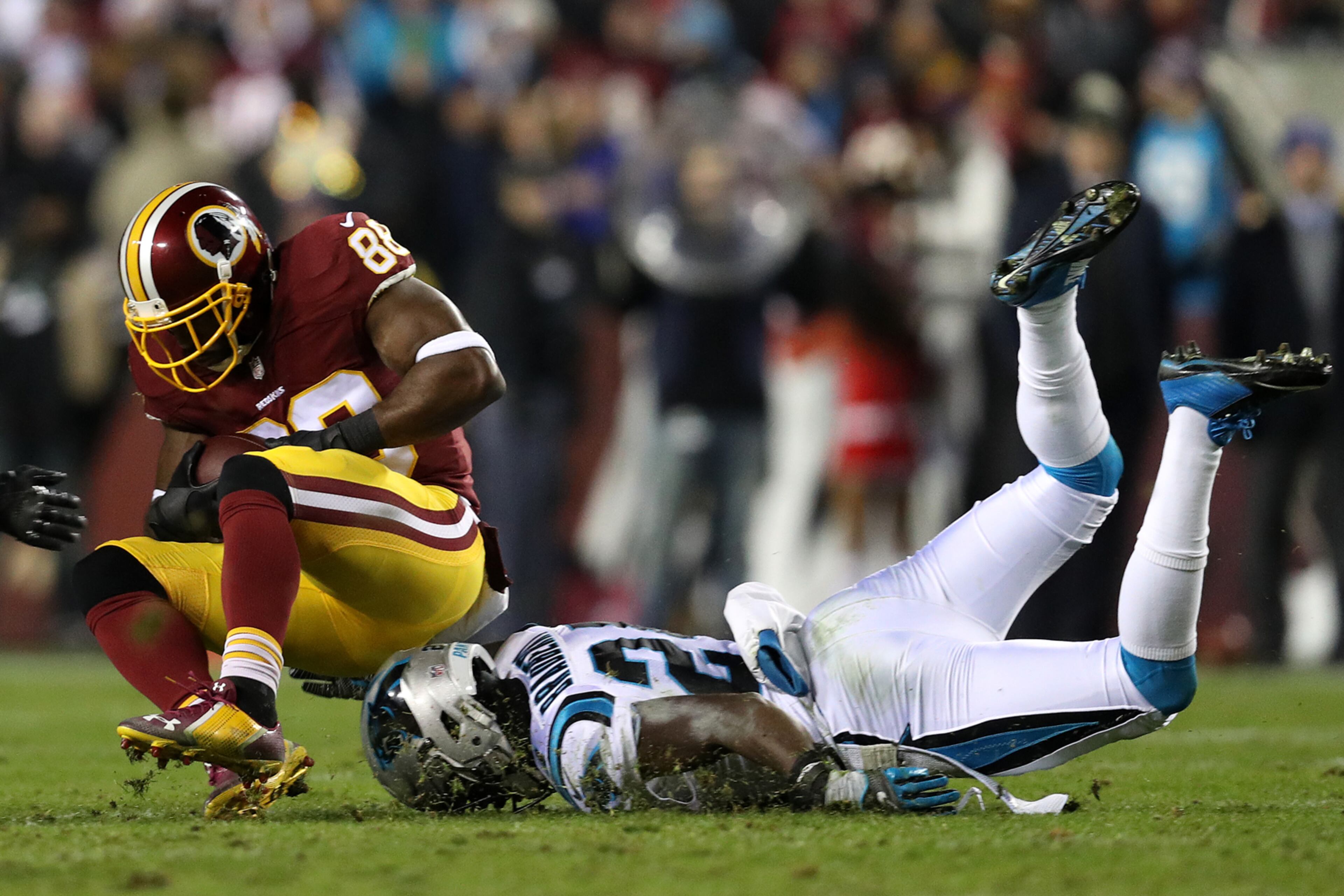 LANDOVER, MD - DECEMBER 19: Wide receiver Pierre Garcon #88 of the Washington Redskins carries the ball against cornerback James Bradberry #24 of the Carolina Panthers in the second quarter at FedExField on December 19, 2016 in Landover, Maryland. (Photo by Patrick Smith/Getty Images) *** BESTPIX ***
