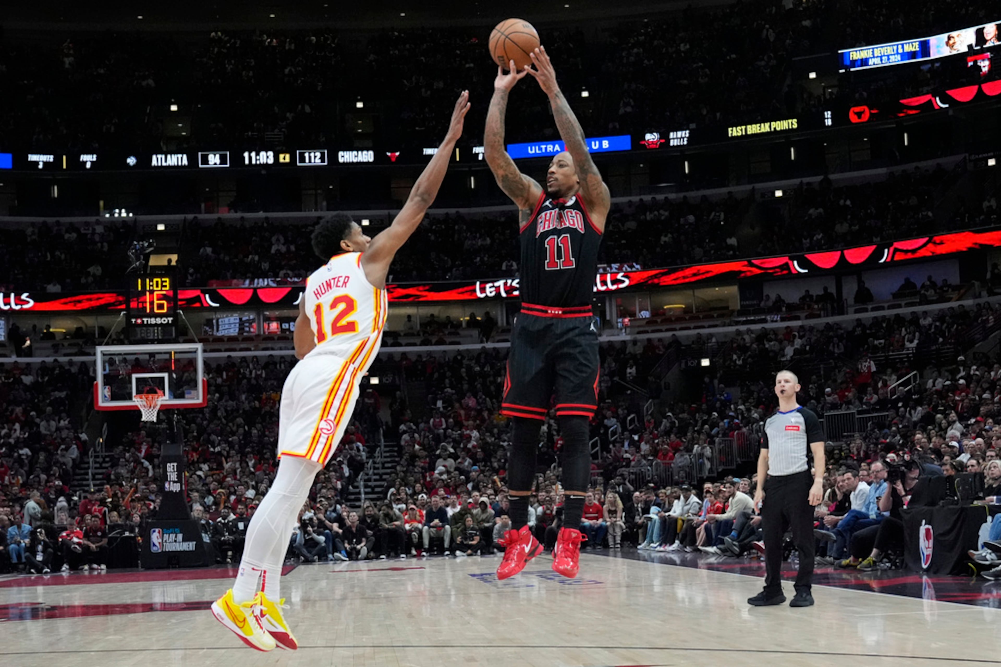 Chicago Bulls forward DeMar DeRozan shoots over Atlanta Hawks forward De'Andre Hunter during the second half of an NBA basketball play-in tournament game in Chicago, Wednesday, April 17, 2024. The Bulls won 131-116. (AP Photo/Nam Y. Huh)
