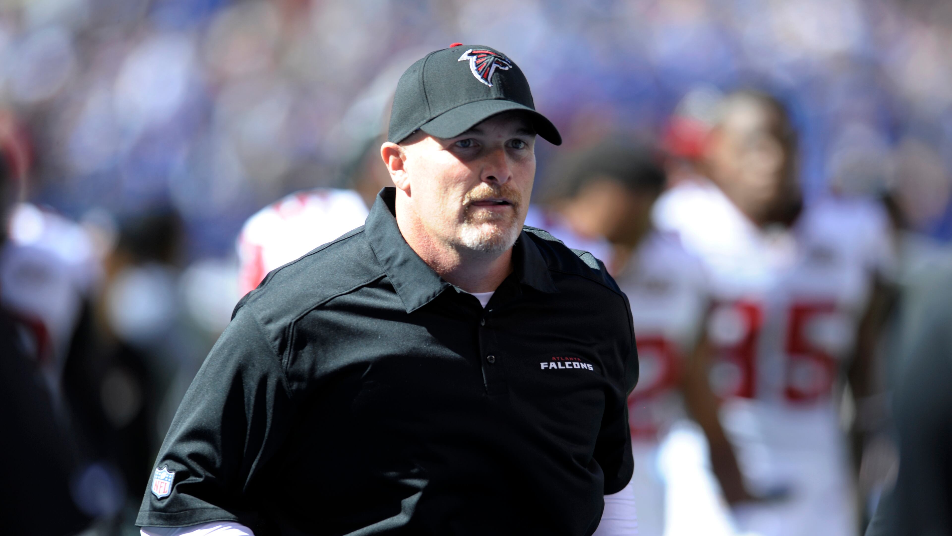 Atlanta Falcons head coach Dan Quinn runs off the field at halftime during an NFL football game against the New York Giants, Sunday, Sept. 20, 2015, in East Rutherford, N.J. (AP Photo/Bill Kostroun)