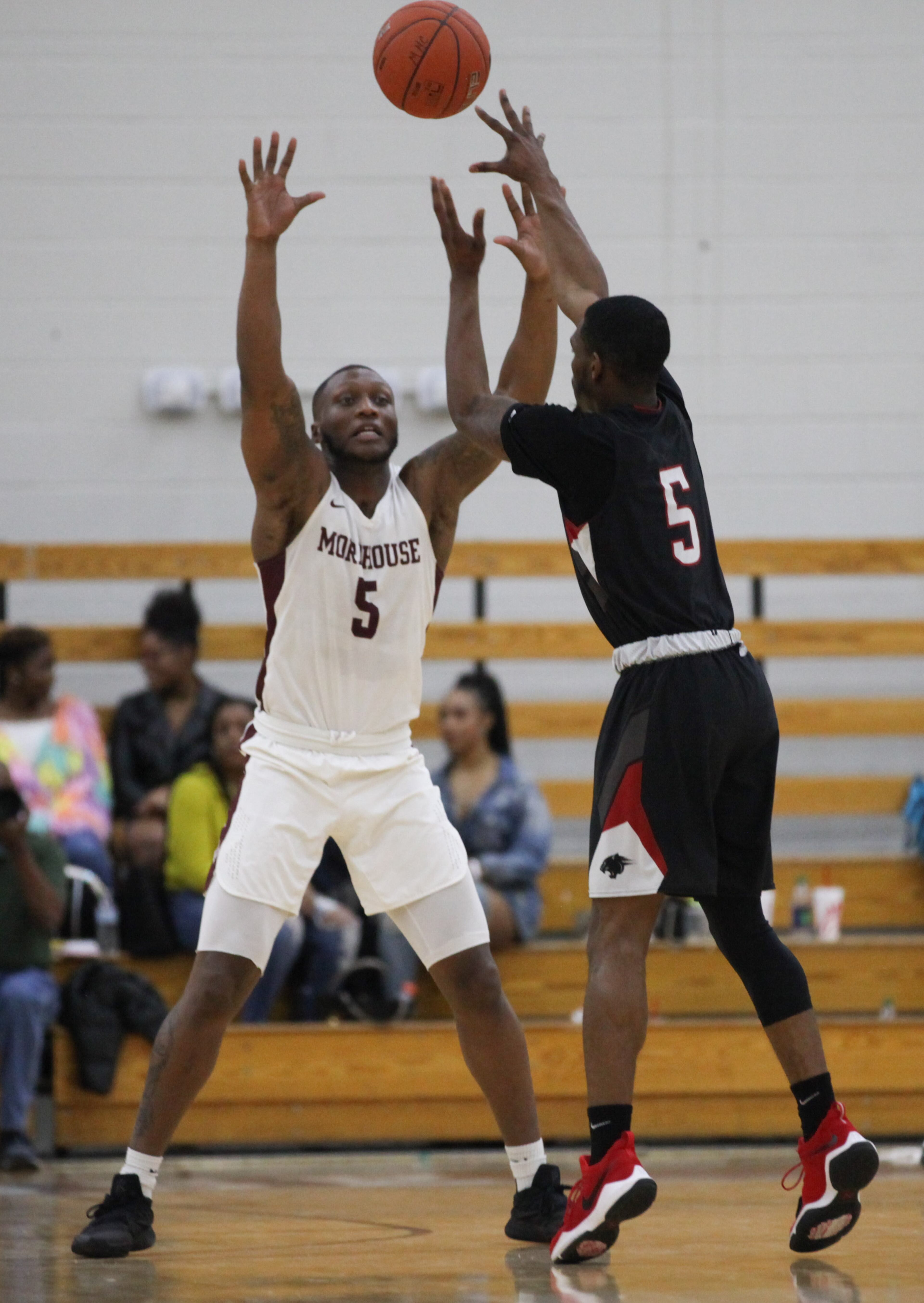 Clark Atlanta player Austin Donaldson (5) shoots over the head of Morehouse player James walker (5) at Morehouse College, Saturday, Feb. 9, 2019, in Atlanta. BRANDEN CAMP/SPECIAL