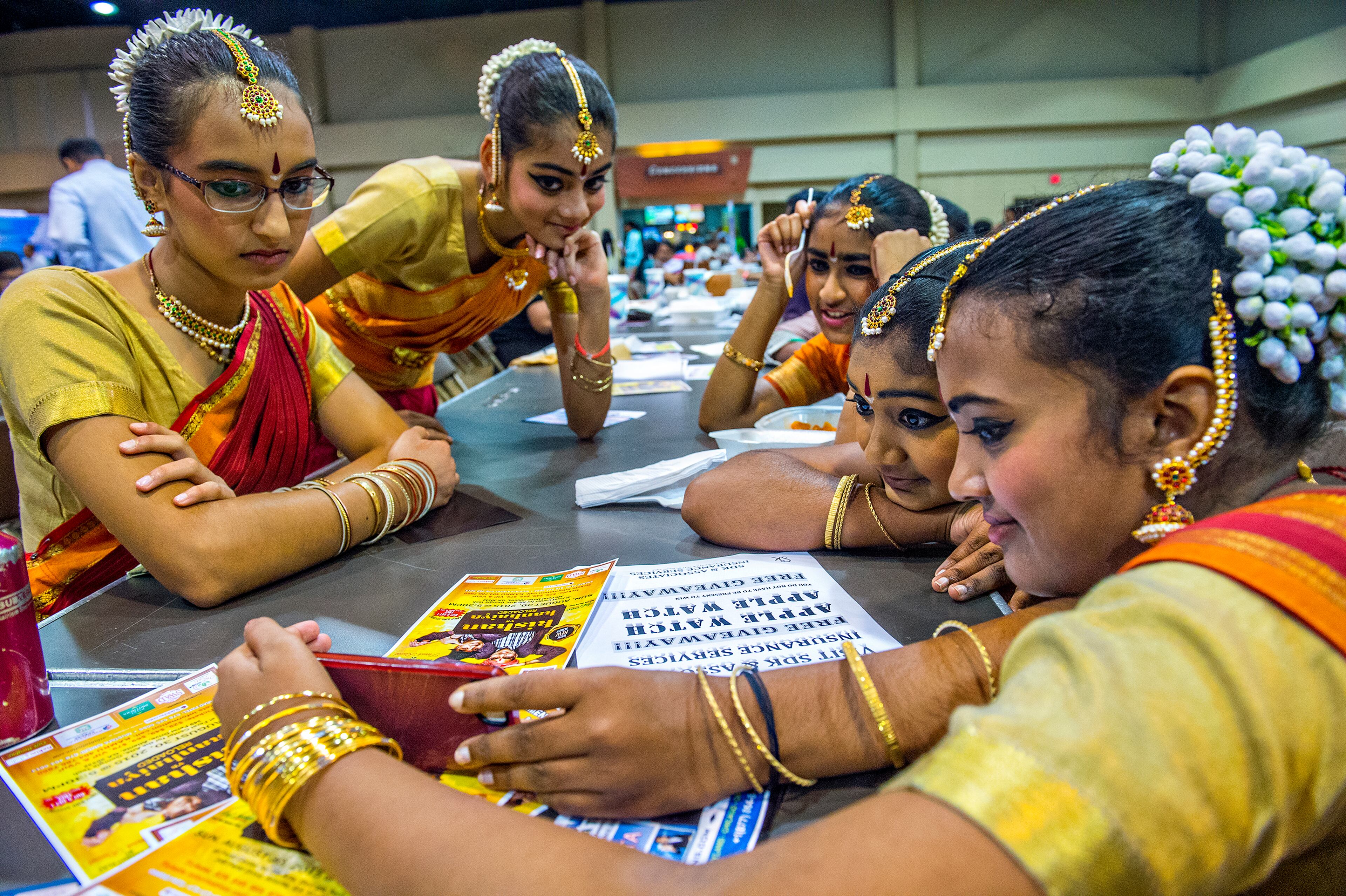 Yumin Shivdasani (left), Keya Parikh, Pallavi Eranezhath, Aarushi Vadhula and Linda Jawahar watch a video of their performance during the Festival of India at the Gwinnett Center in Duluth on Saturday, August 22, 2015. The festival helps commemorate India's freedom from the British which occurred in 1947. JONATHAN PHILLIPS / SPECIAL