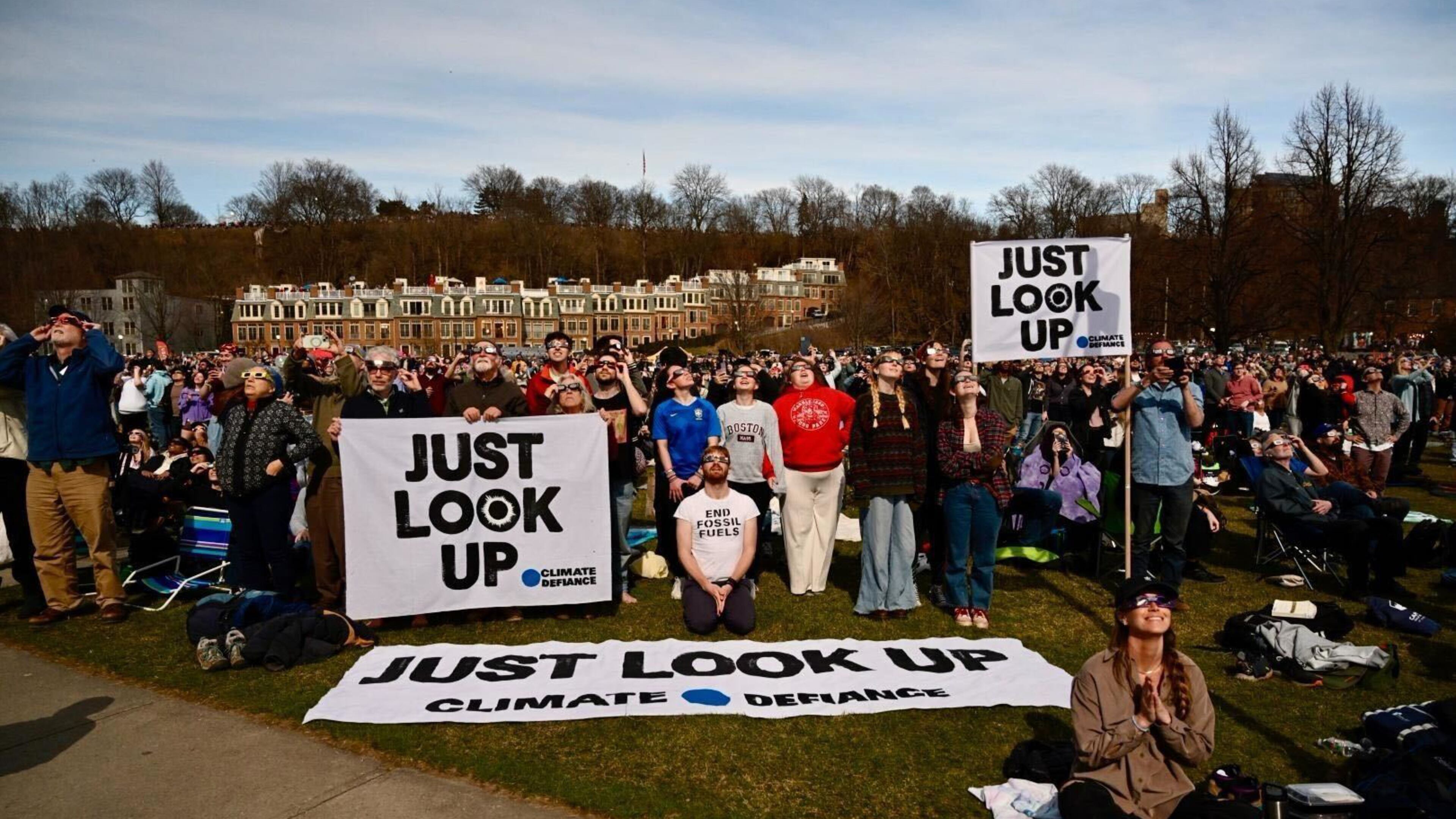 Members of Climate Defiance use the solar eclipse to raise awareness about climate issues during totality in Burlington, Vermont. (Courtesy of Climate Defiance)