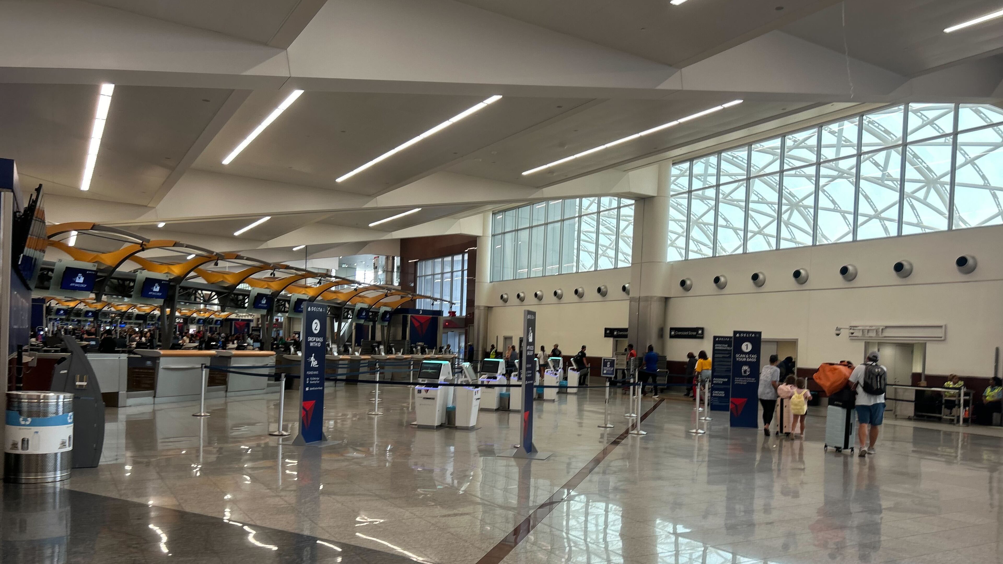 Security wait times at Hartsfield-Jackson Atlanta International Airport ranged from seven to 15 minutes around 3 p.m. Sunday, July 6, 2025, as travelers returned from the long Fourth of July weekend. (Gray Mollenkamp/AJC)