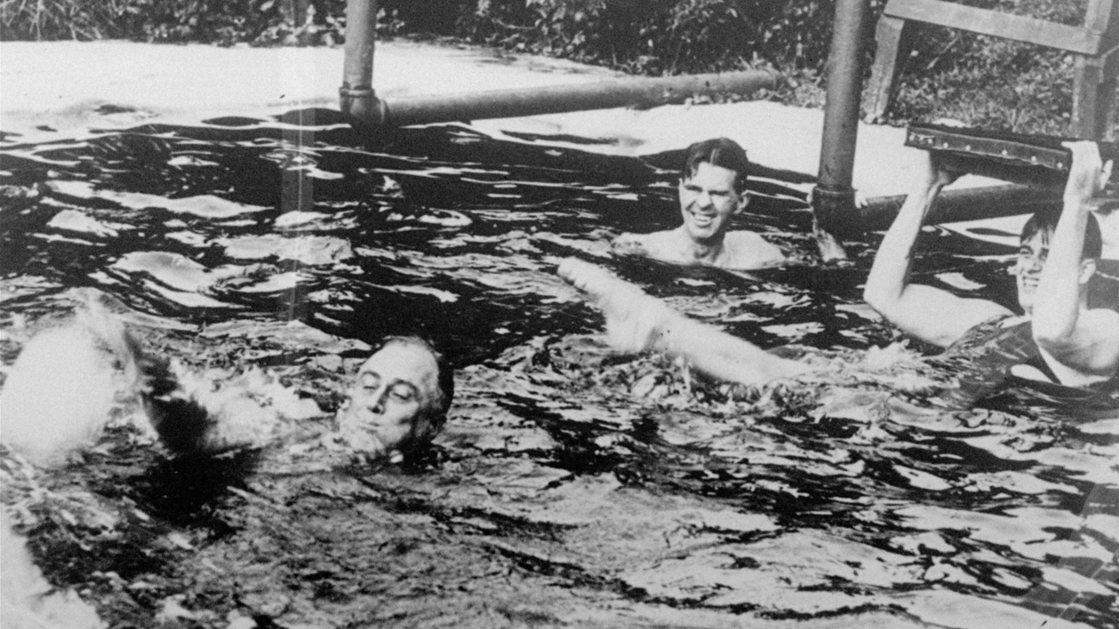President Franklin D. Roosevelt, lower left, is shown swimming in the pool of the Polio Foundation in Warm Springs in March 1935. Roosevelt in 1927 established a polio treatment facility there that became the Roosevelt Warm Springs Rehabilitation Hospital. (AP Photo/FILE)