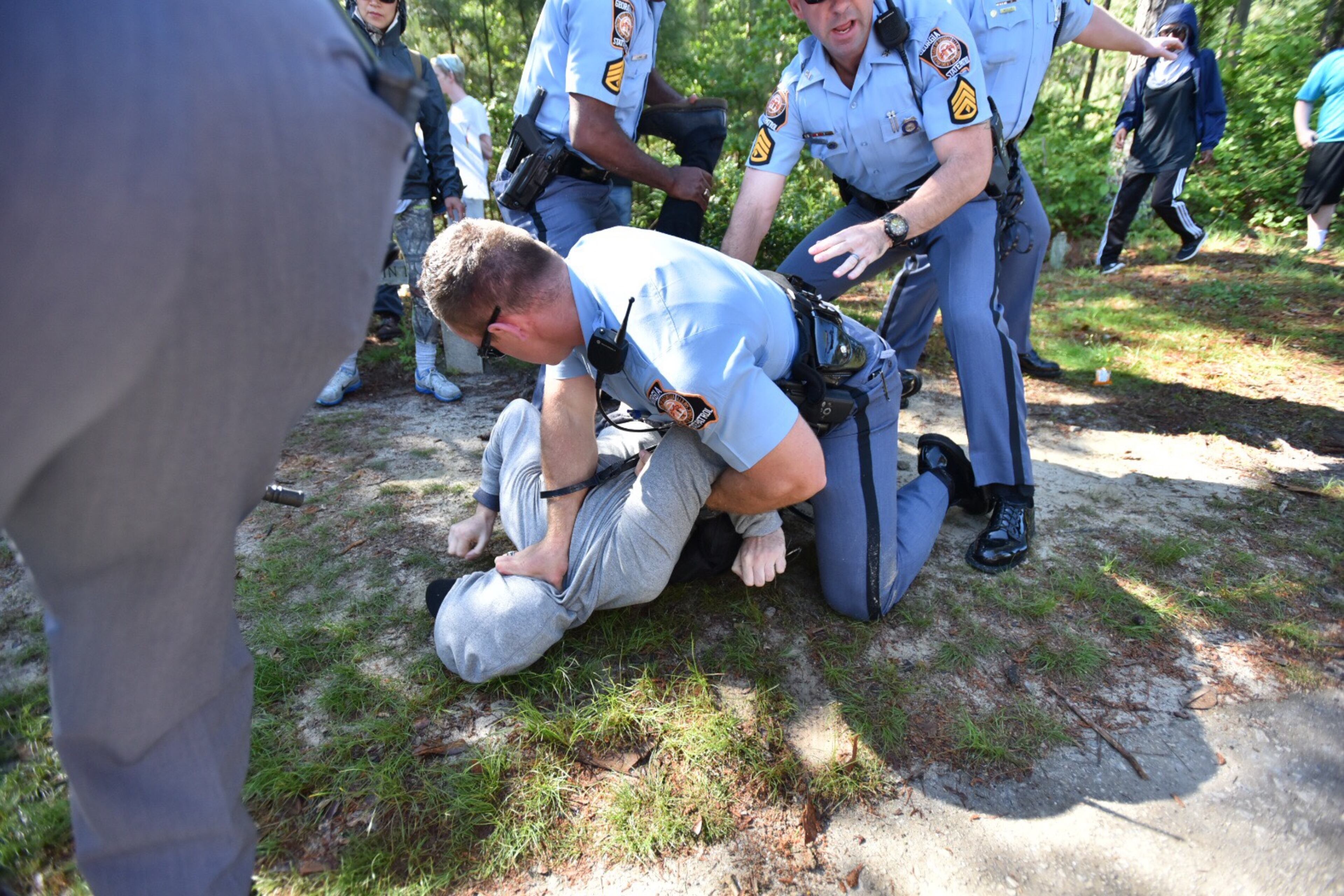 Protesters clash with police near a “white power” rally in Stone Mountain on Saturday, April 23, 2016. The protesters said they are opposing the message of hate at the supremacist rally also taking place at the park.