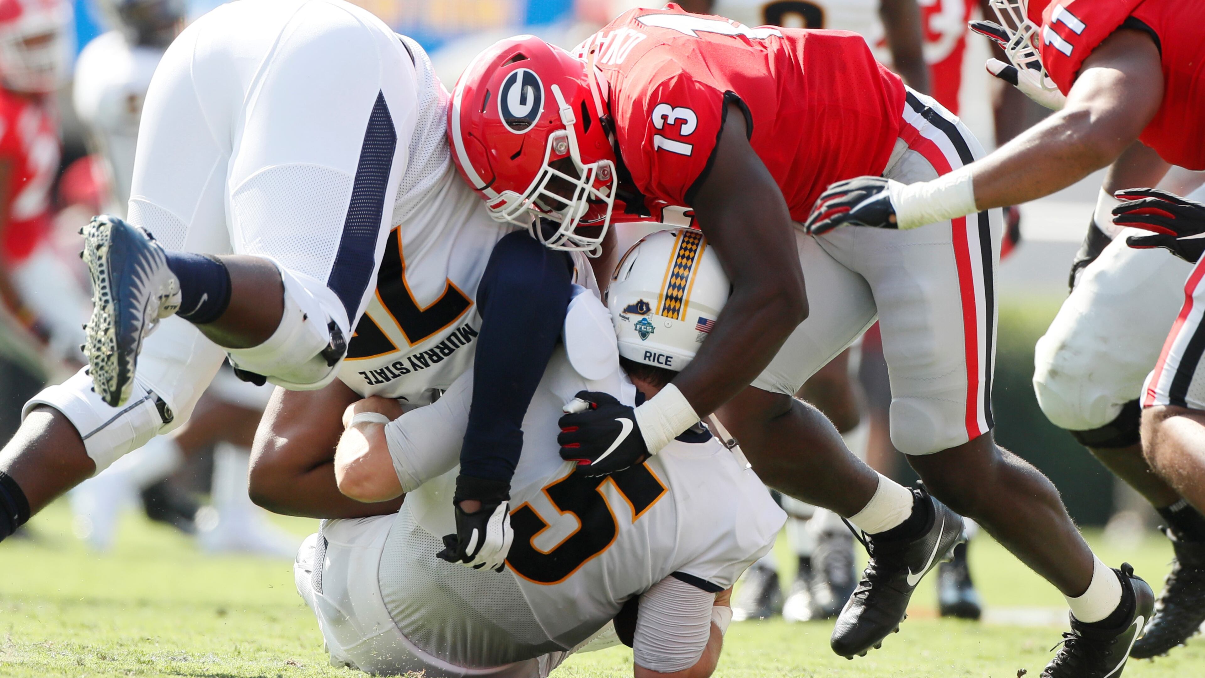 Georgia Bulldogs linebacker Azeez Ojulari (13) sacks Murray State Racers quarterback Preston Rice (5) during the first half of today's Georgia vs Murray State football game at Sanford Stadium. Bob Andres / robert.andres@ajc.com