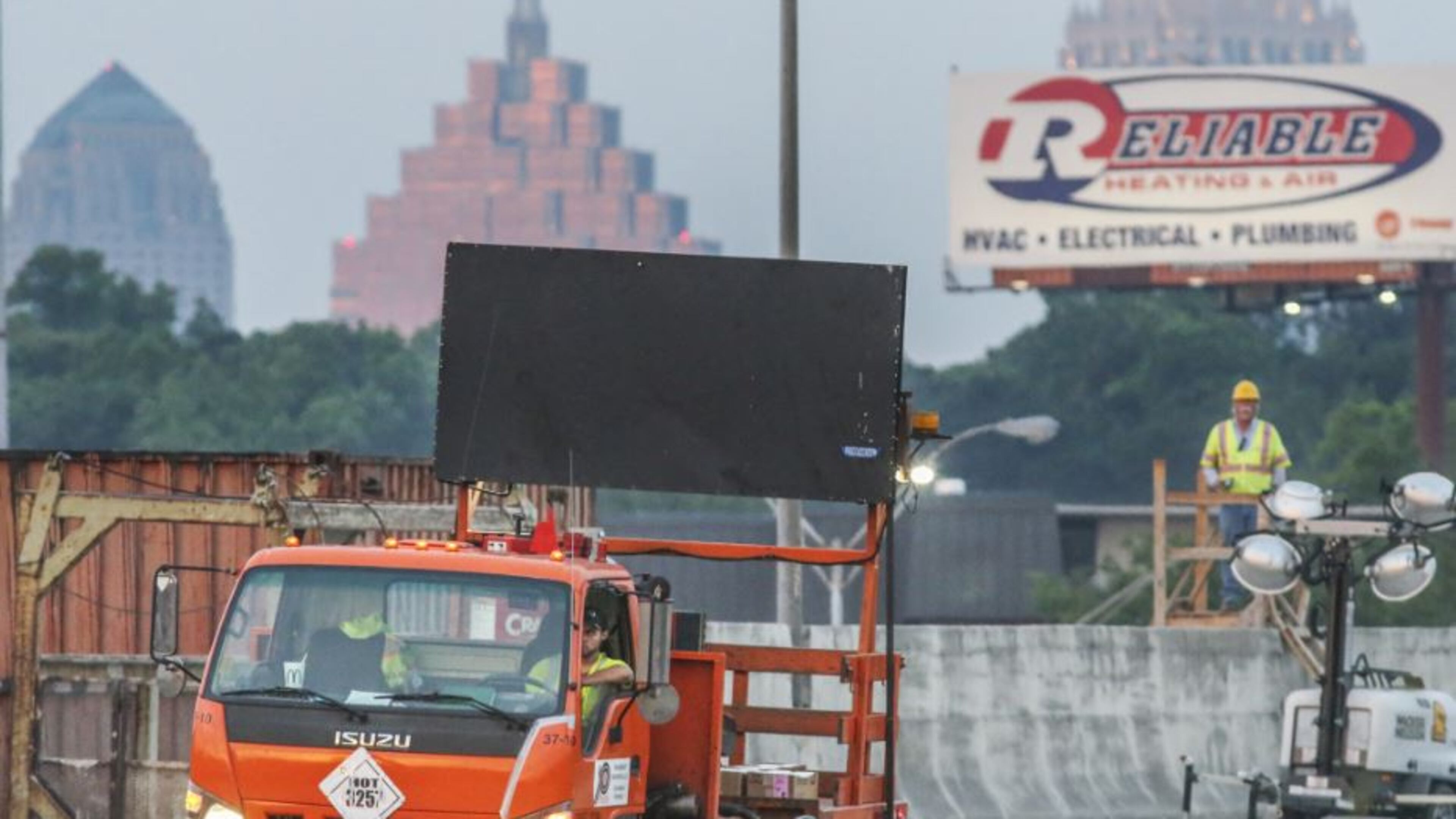 Construction crews were seen installing road reflectors on Friday morning May 12, 2017 as last-minute preparations for the reopening of I-85 in Atlanta continued. JOHN SPINK/JSPINK@AJC.COM