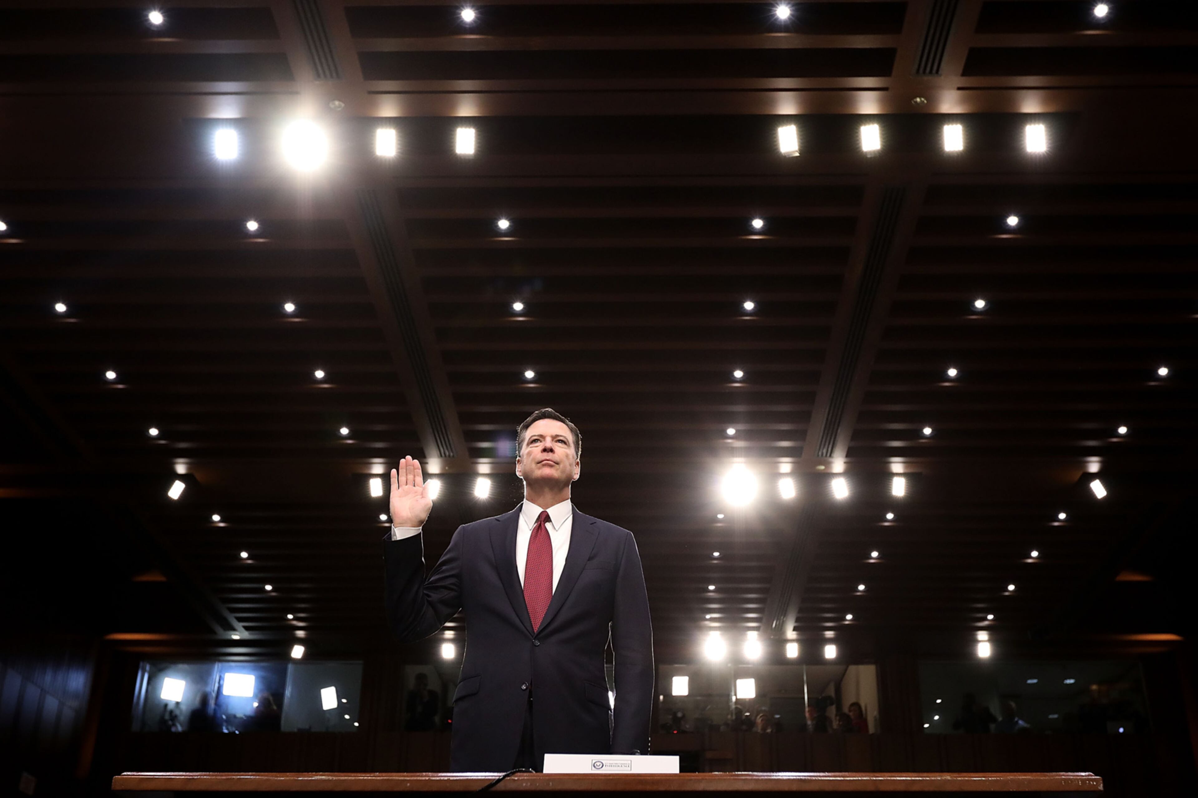WASHINGTON, DC - JUNE 08: Former FBI Director James Comey is sworn in while testifying before the Senate Intelligence Committee in the Hart Senate Office Building on Capitol Hill June 8, 2017 in Washington, DC. Comey said that President Donald Trump pressured him to drop the FBI's investigation into former National Security Advisor Michael Flynn and demanded Comey's loyalty during the one-on-one meetings he had with president. (Photo by Chip Somodevilla/Getty Images)