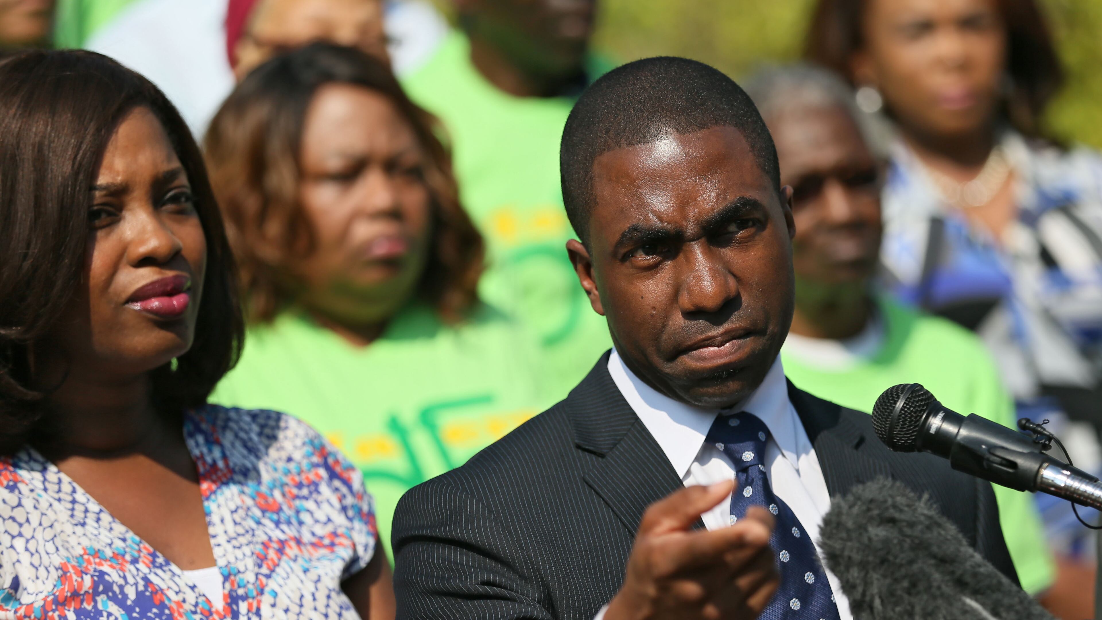 Interim DeKalb CEO Lee May, with his wife Robin, held at a press conference at the Lou Walker Senior Center in Lithonia on May 8. BOB ANDRES / BANDRES@AJC.COM