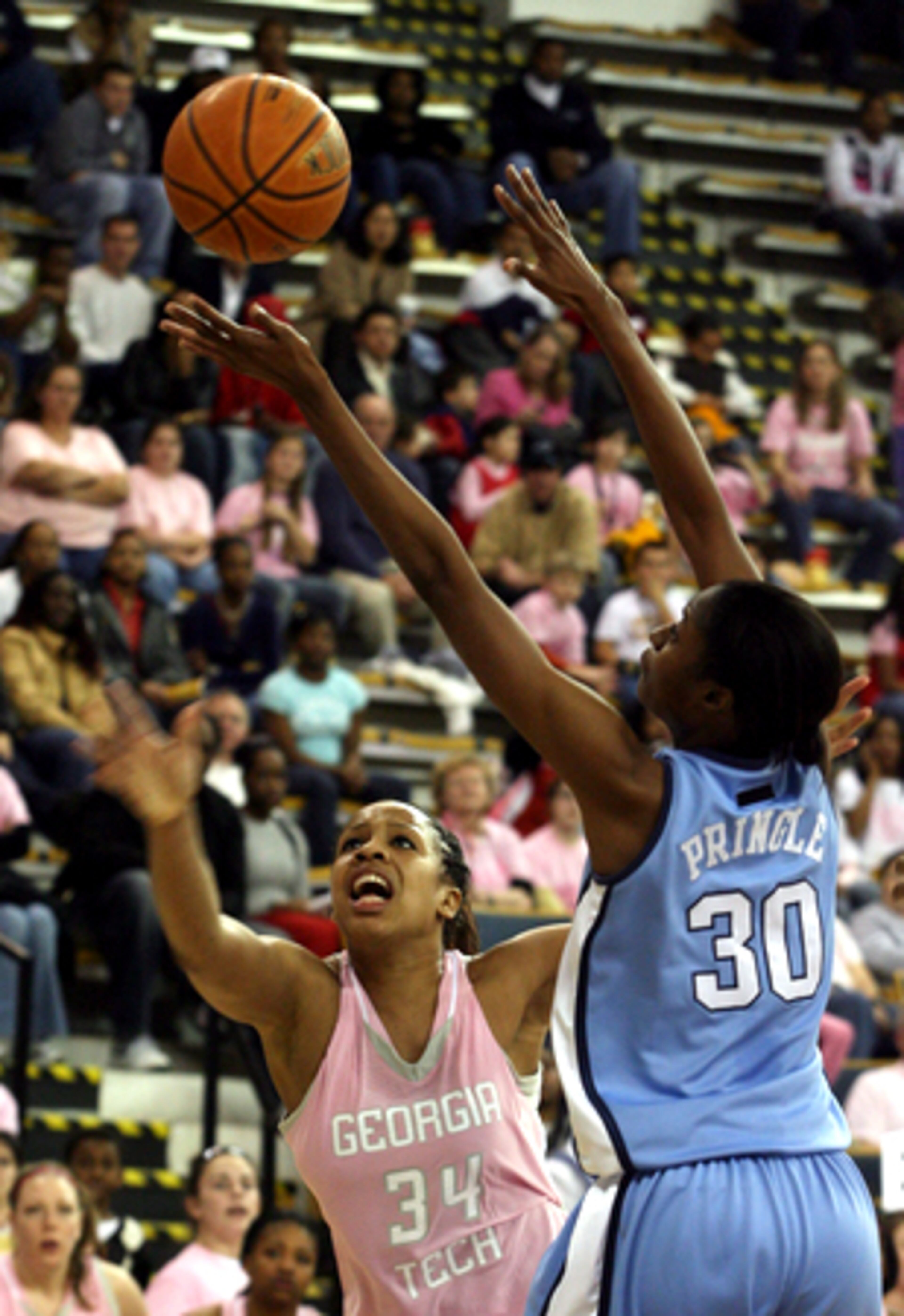 Georgia Tech's Iasia Hemingway (left) and North Carolina's LaToya Pringle reach for a rebound.