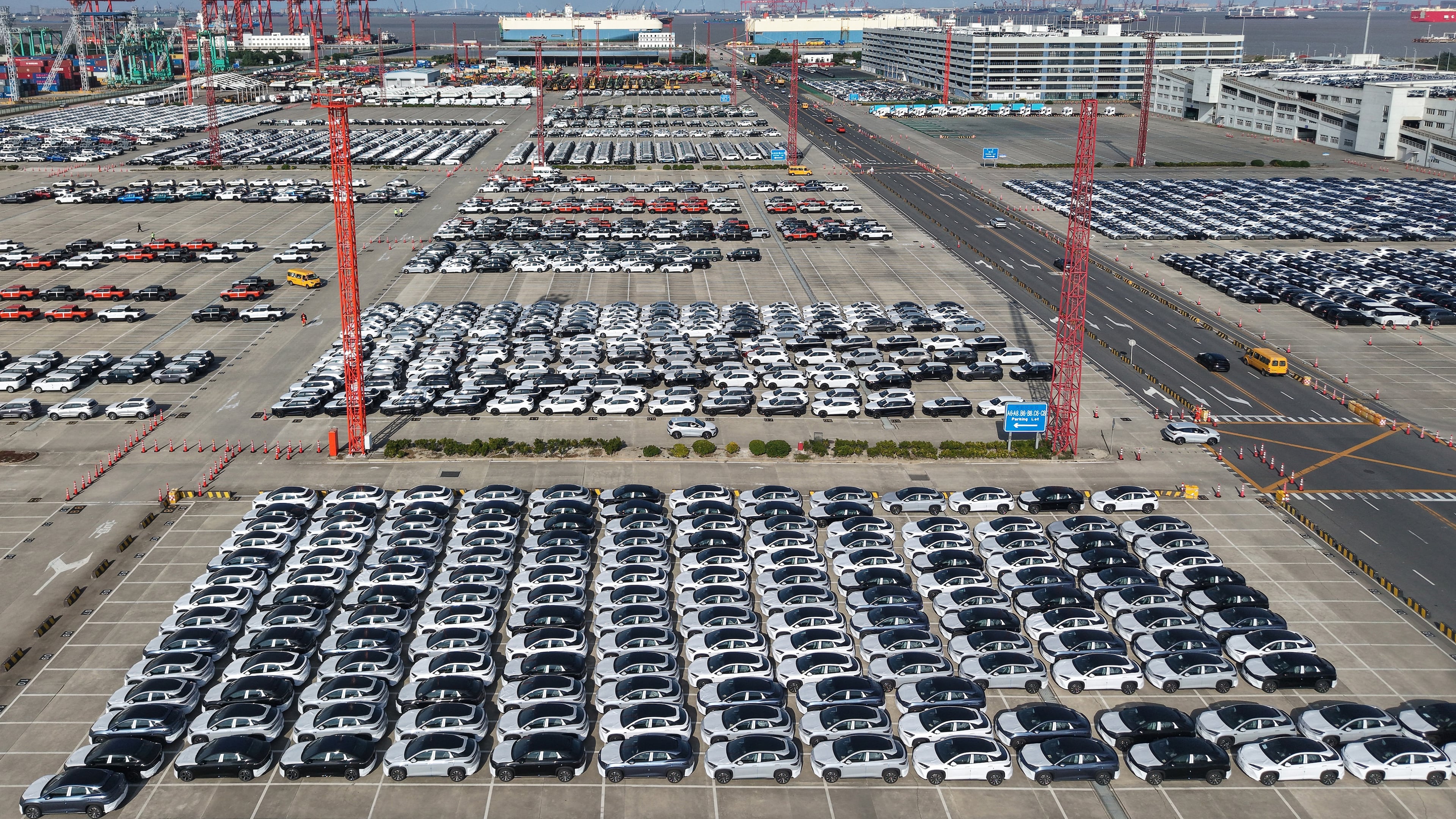 Aerial view of new cars waiting for shipment at a port in Shanghai, China, Wednesday, Jan. 14, 2026. (Chinatopix Via AP)
