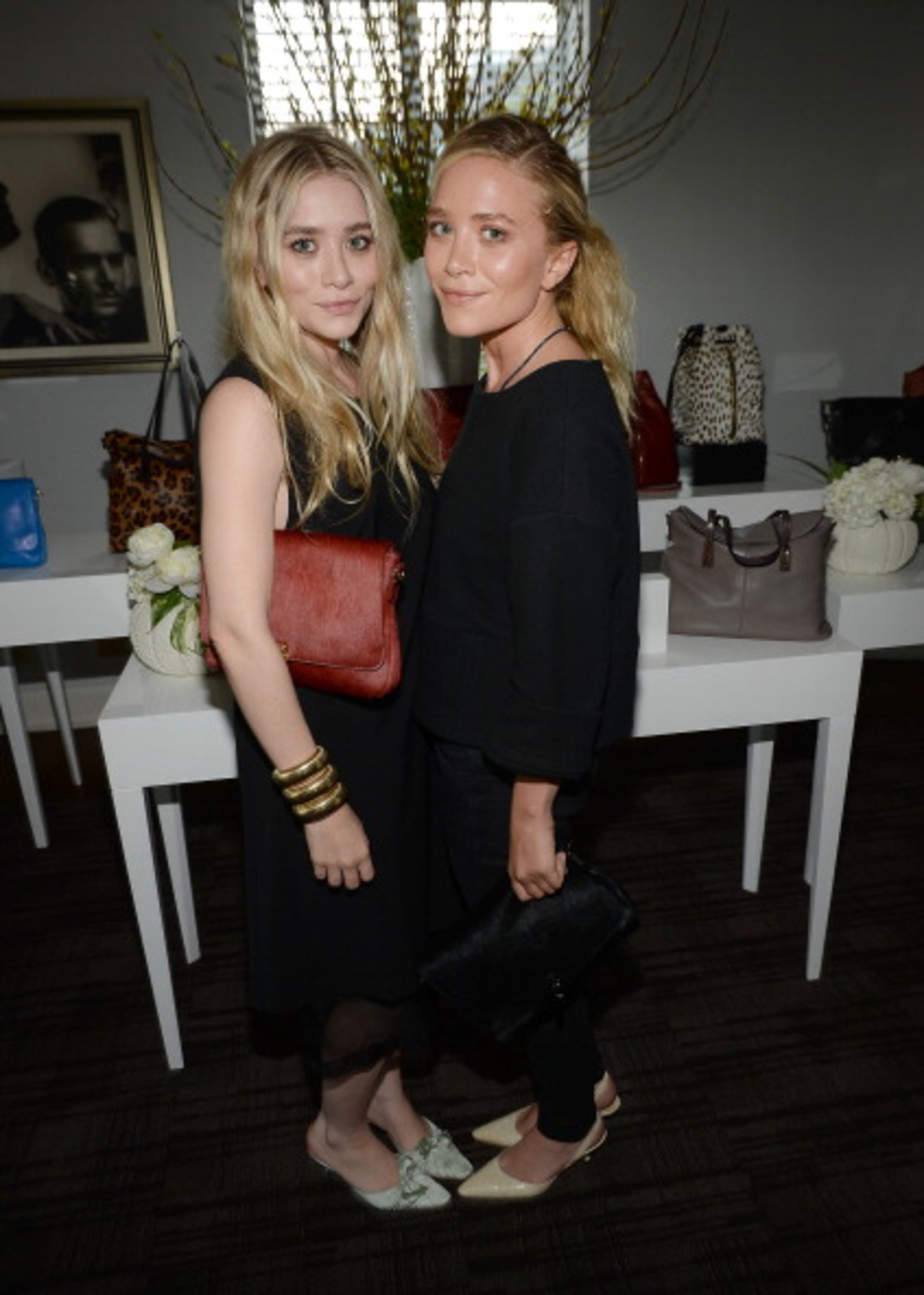 LOS ANGELES, CA - JUNE 19: Ashley Olsen (L) and Mary-Kate Olsen attend Mary-Kate Olsen, Ashley Olsen, and InStyle Editor Ariel Foxman celebrate the launch of the Elizabeth and James Fall 2013 Handbag Collection at a cocktail party held at Chateau Marmont in West Hollywood on June 19, 2013. (Photo by Michael Buckner/Getty Images for InStyle)