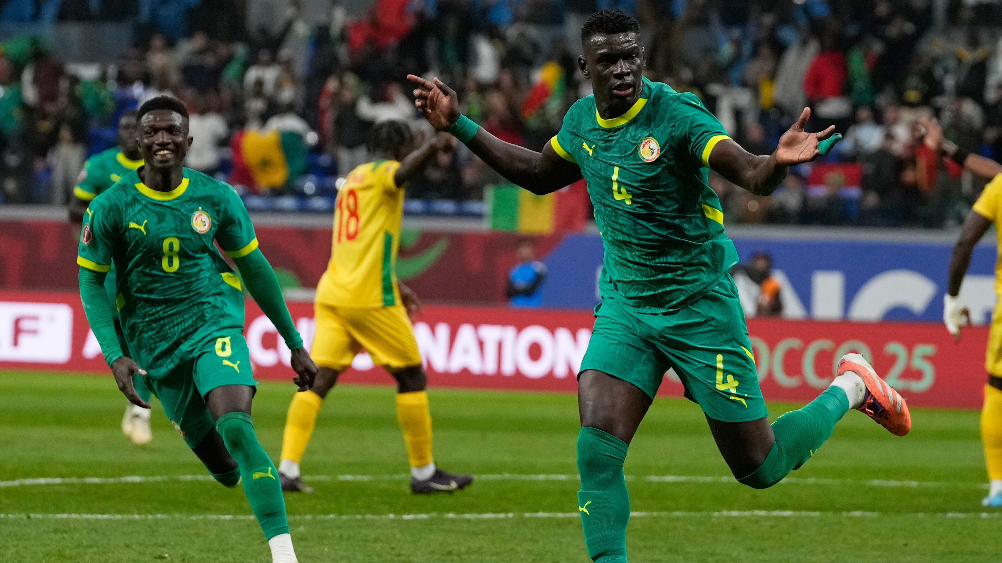 Senegal's Abdoulaye Seck, right, celebrate his goal with his teammates during the Africa Cup of Nations group D soccer match between Benin and Senegal in Tangier, Morocco, Tuesday, Dec. 30, 2025. (AP Photo/Themba Hadebe)