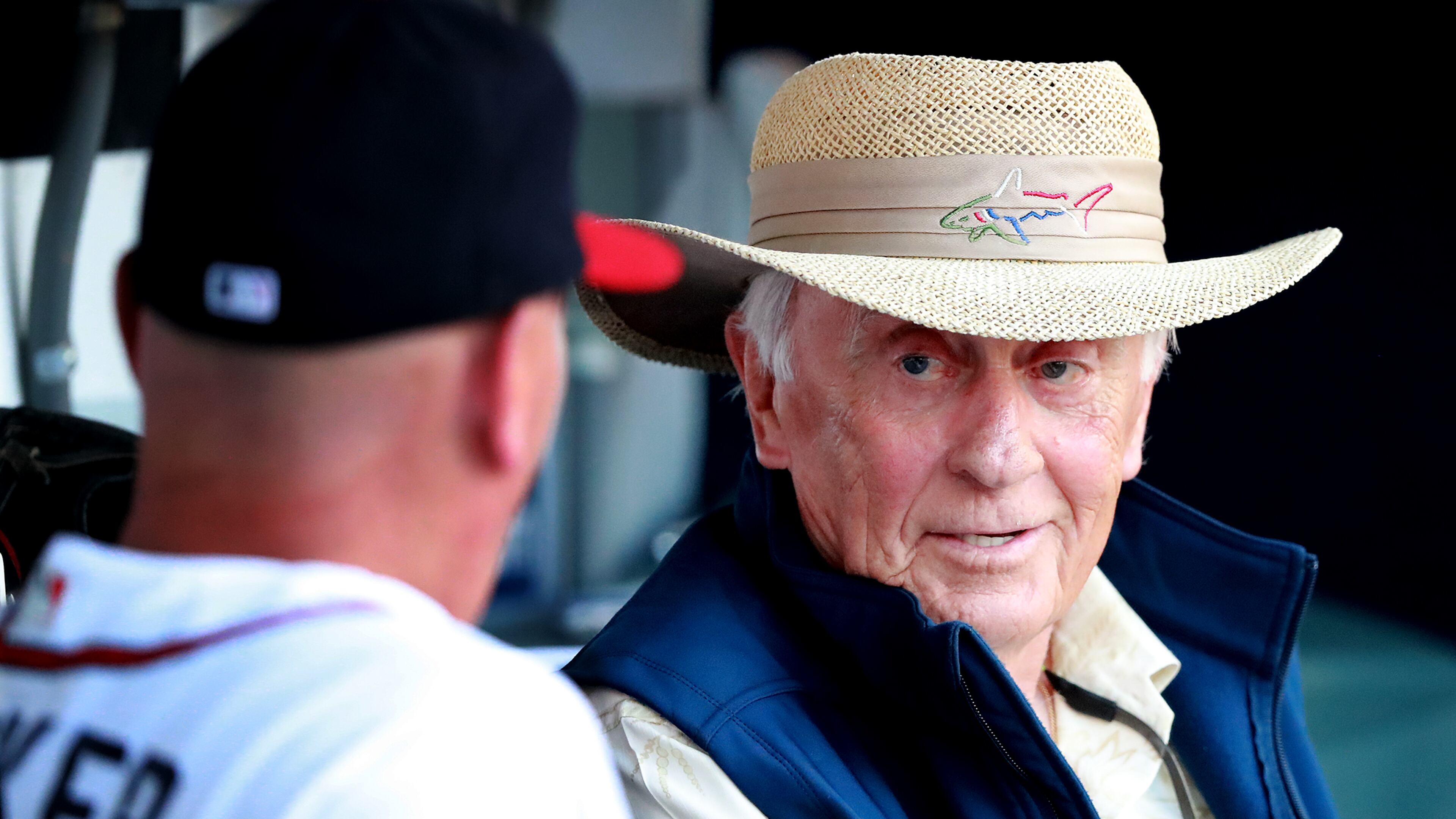 Braves great Phil Niekro (right) visits with manager Brian Snitker in the dugout before a game. (Curtis Compton/ccompton@ajc.com)