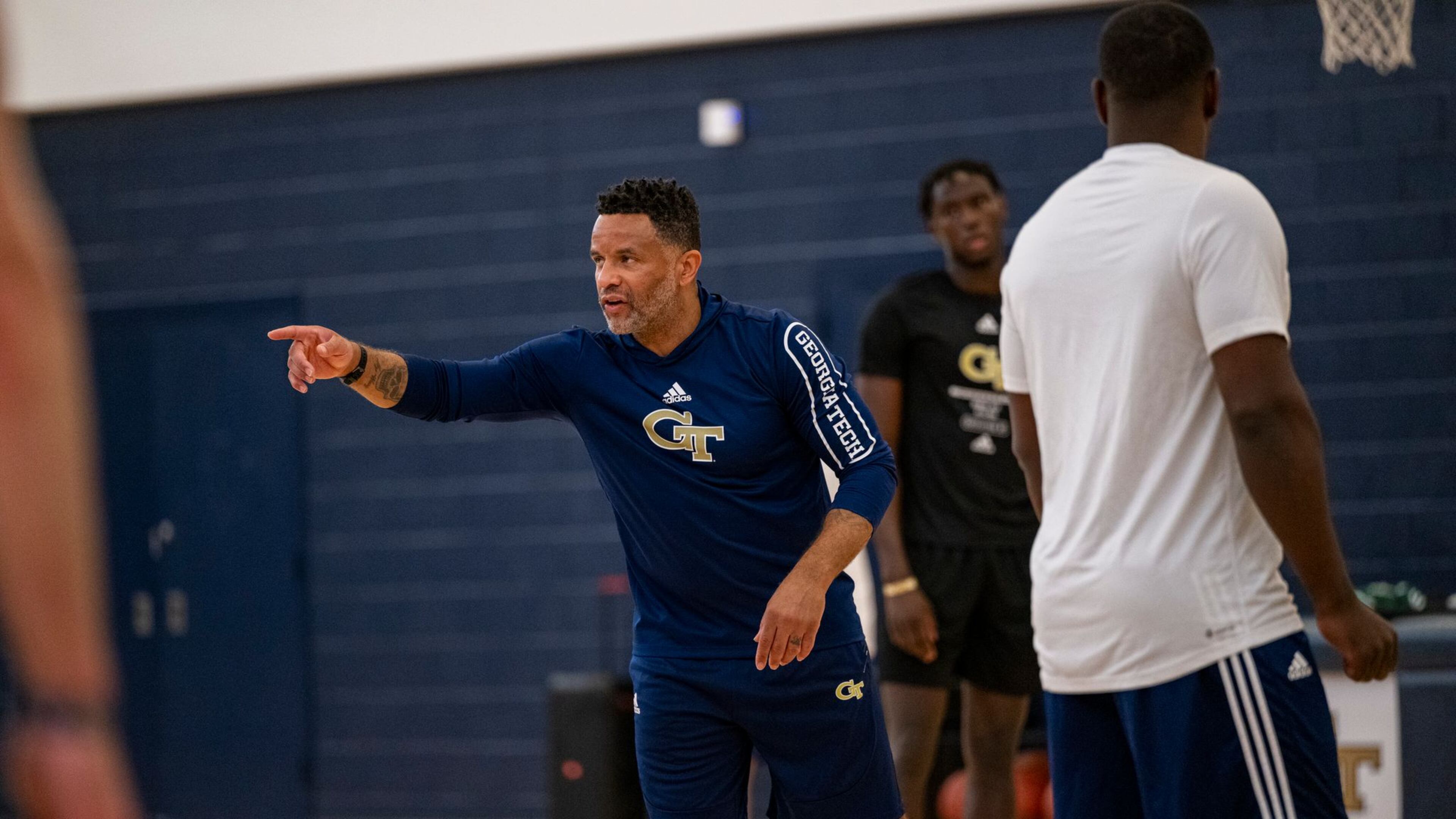 Georgia Tech men's basketball coach Damon Stoudamire works with his team during a practice.
