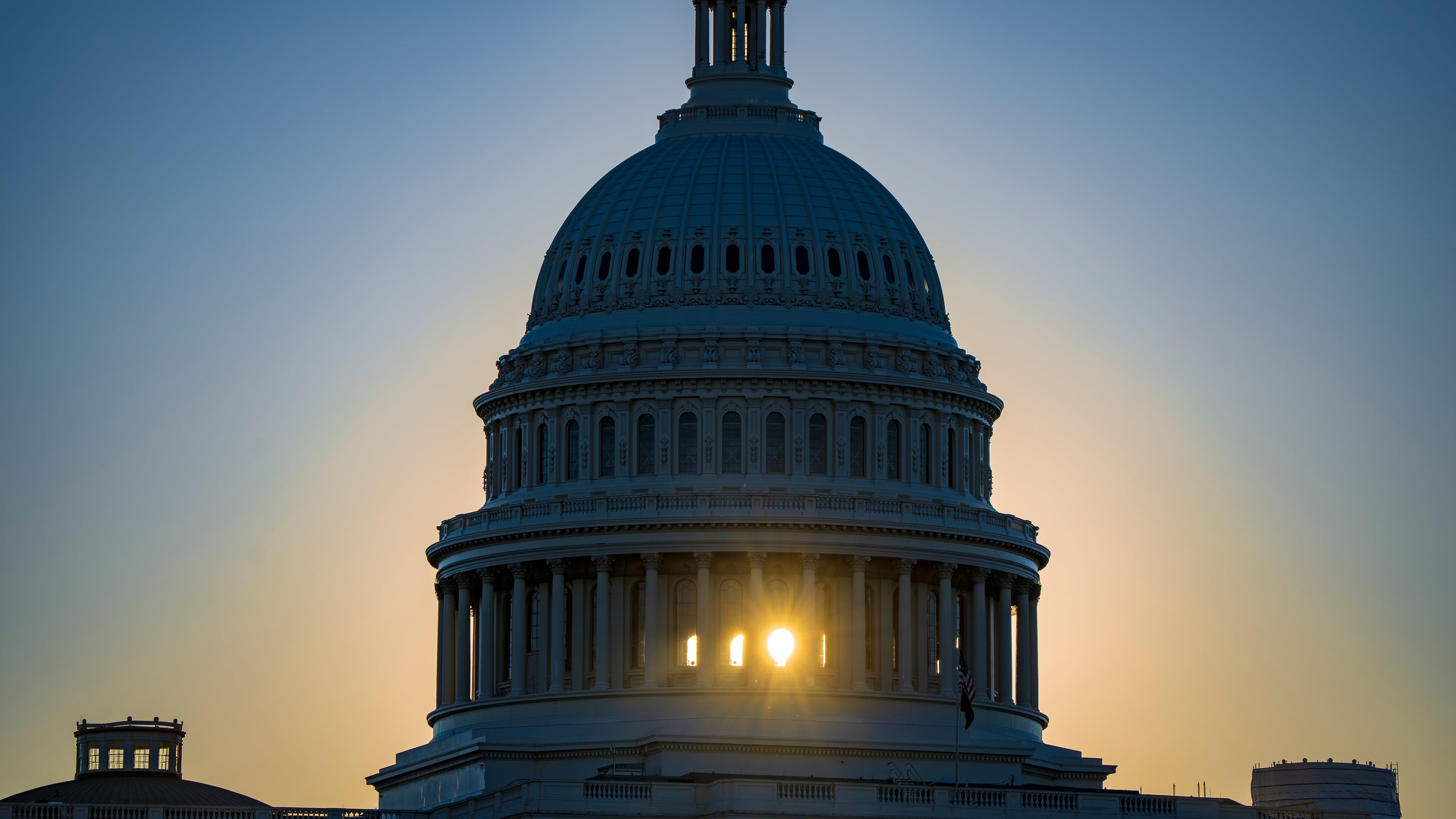 The sun rises behind the Capitol Dome in Washington, Tuesday, Oct. 20, 2026, two weeks before the midterm elections that will determine political control of Congress. (AP Photo/J. Scott Applewhite)