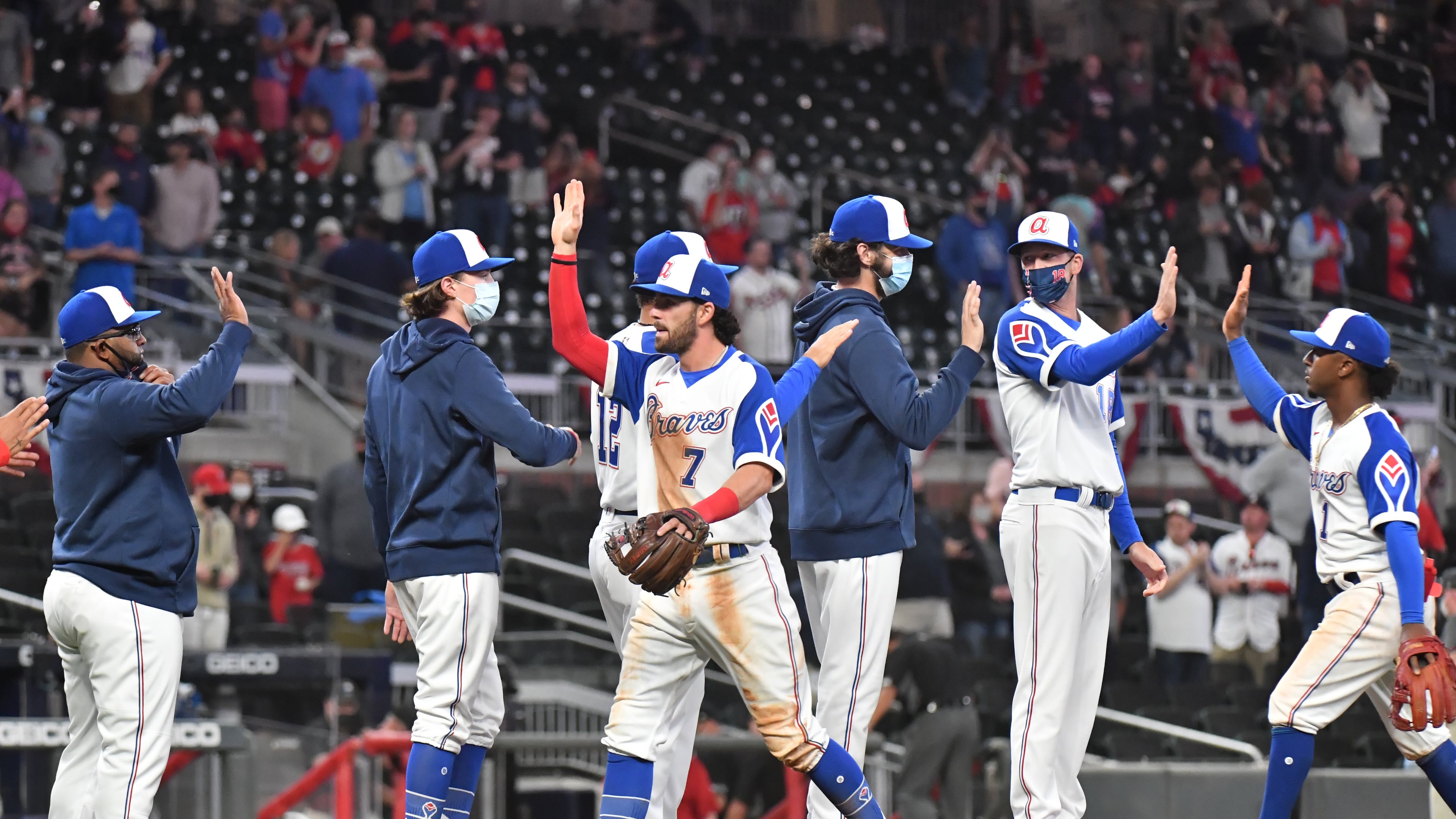 April 9, 2021 Atlanta - Atlanta Braves players celebrate after they defeated Philadelphia Phillies at Truist Park on Friday, April 9, 2021. Atlanta Braves won 8-1 over Philadelphia Phillies. (Hyosub Shin / Hyosub.Shin@ajc.com)