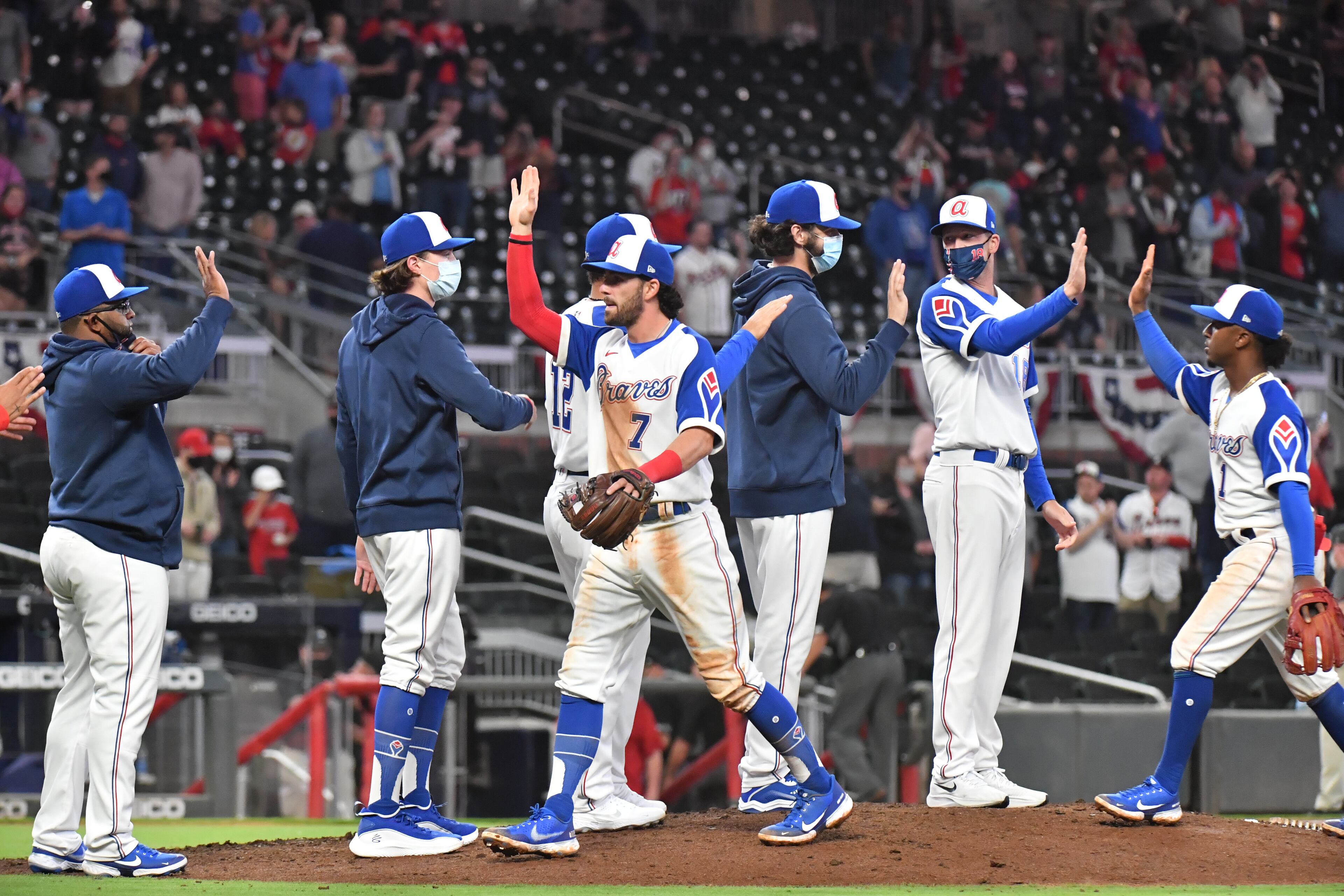 Braves players celebrate after they defeated the Philadelphia Phillies 8-1 at Truist Park on Friday. (Hyosub Shin / Hyosub.Shin@ajc.com)