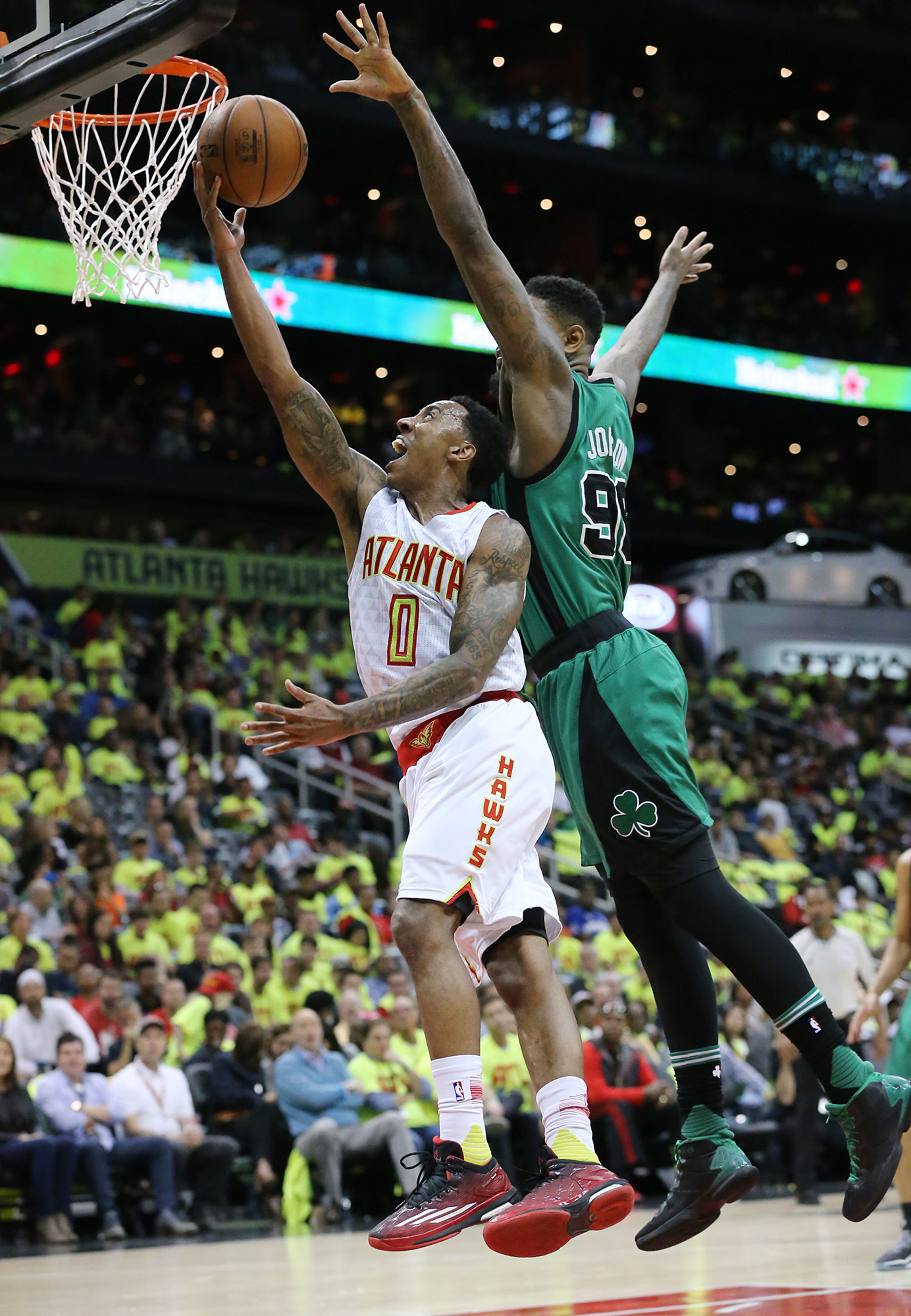 041616 ATLANTA: Hawks Jeff Teague goes to the basket past Amir Johnson for two of his 23 points on the way to beating the Celtics 102-101 in game one of their NBA Eastern Conference first round playoff game at Philips Arena on Saturday, April 16, 2016. Curtis Compton / ccompton@ajc.com