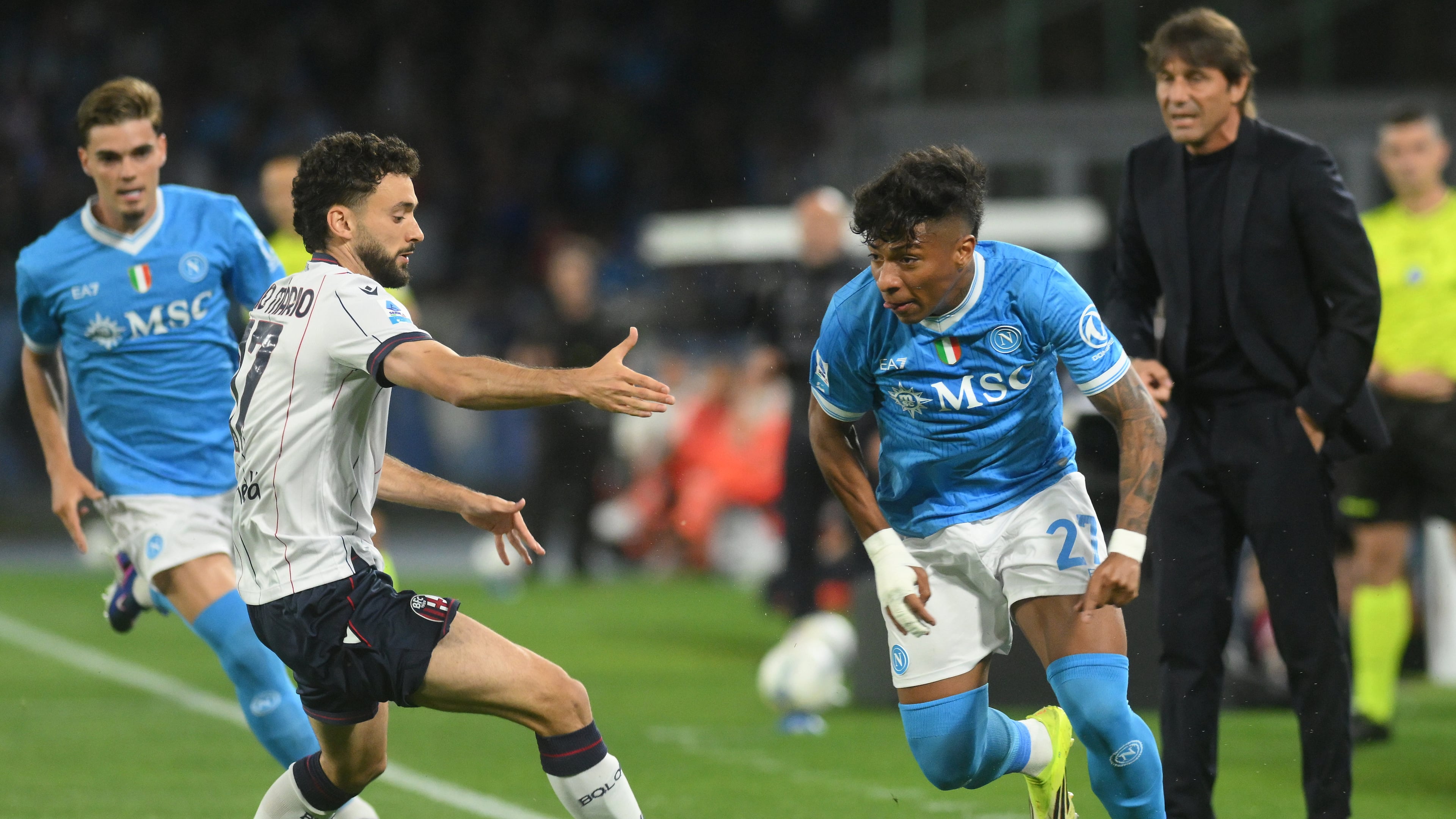 Bologna's Joao Pedro, second left, challenges for the ball with Napoli's Alisson Santos during the Italian Serie A soccer match between Napoli and Bologna in Naples, Italy, Monday, May 11, 2026. (Alessandro Garofalo/LaPresse via AP)