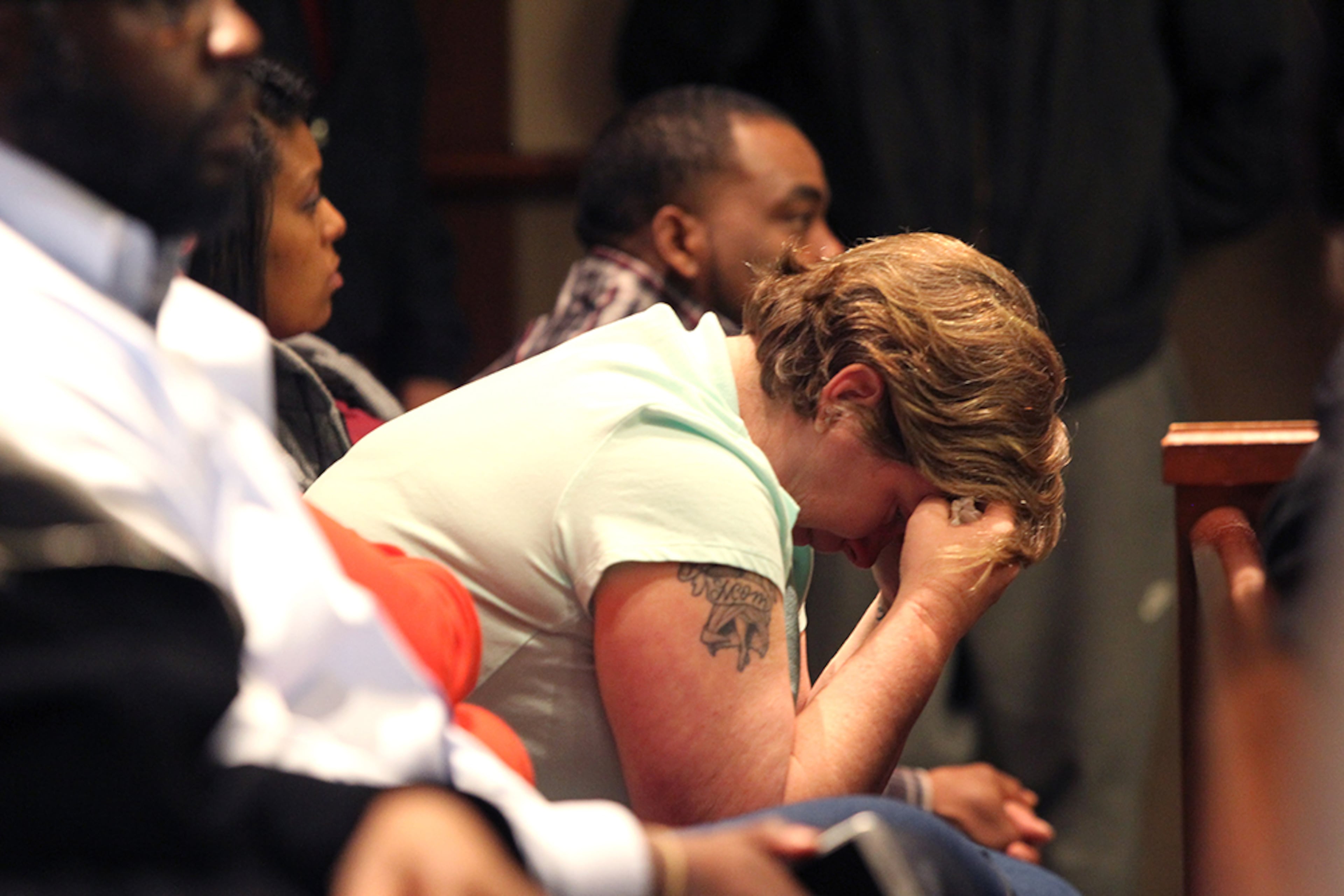 An observer in the gallery of the sentencing for Jose Torres and Kayla Norton weeps in the Douglas County Courthouse in Douglasville, Georgia, on Monday, February 27, 2017. Many present in the crowd that were there for Torres and Norton wept and grieved following the sentencing of 20 years, 13 of which would be spent in prison for Torres, and 15 years, six of which would be spent in prison for Norton. (HENRY TAYLOR / HENRY.TAYLOR@AJC.COM)