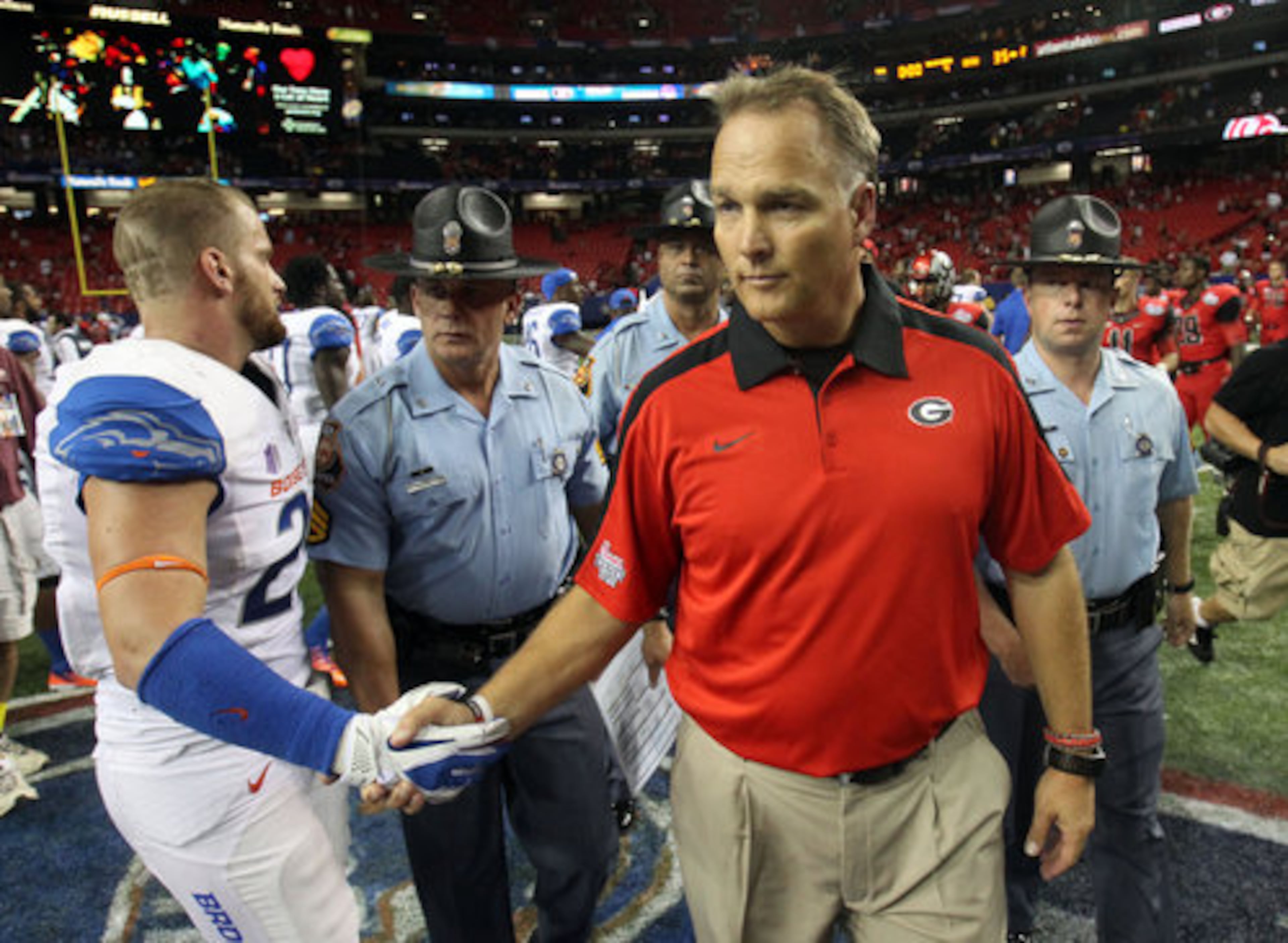Georgia coach Mark Richt greets a Boise State player after the game.